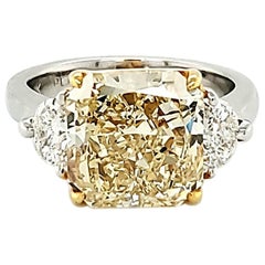 GIA Certified 5.30 Carat Fancy Yellow Radiant Cut Three-Stone Ring