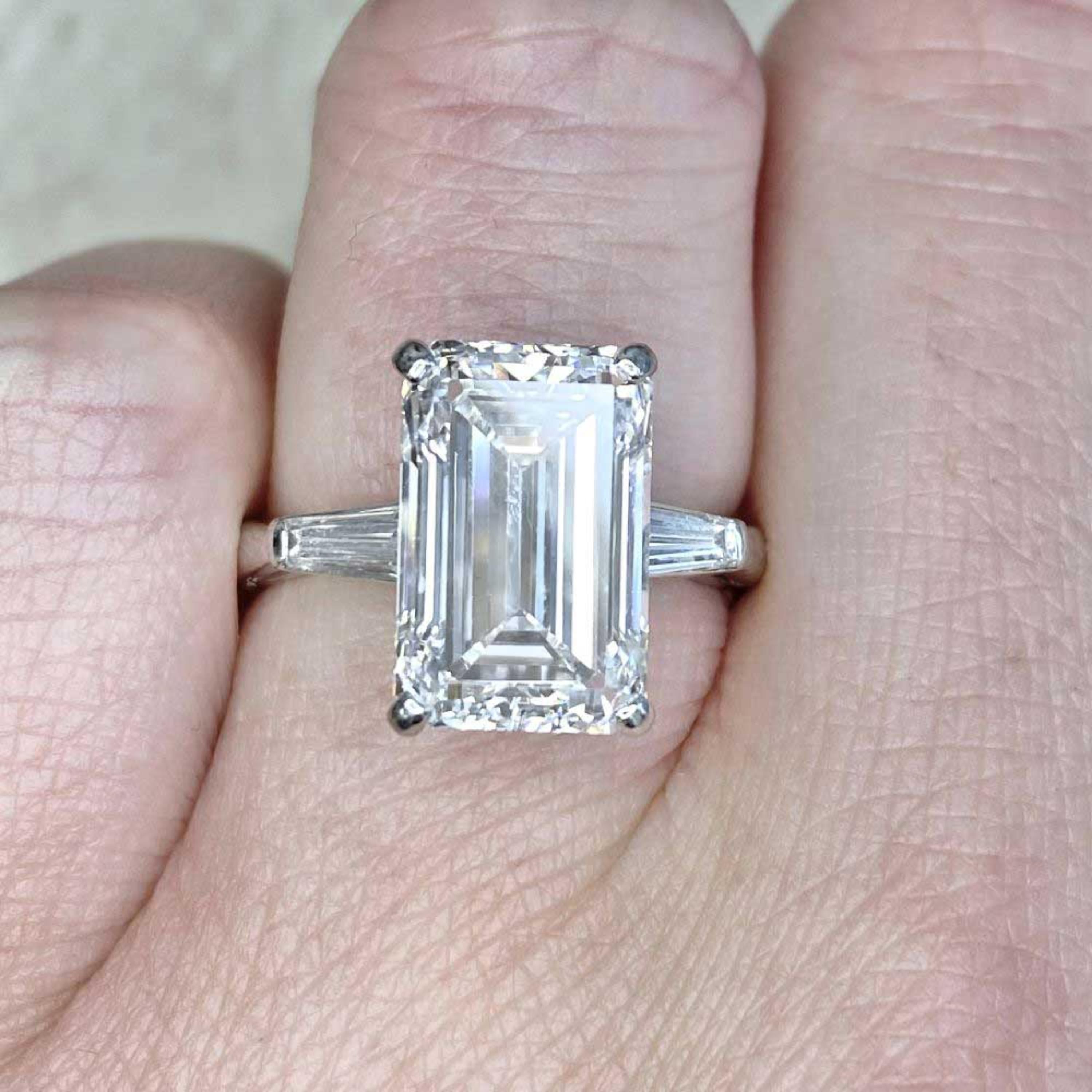 GIA Certified Giant 5.31 Carat F Color Rare Diamond Three Stone Engagement Ring

A Copy of the GIA Certificate is Available Upon Request.

A stunning ring featuring IGI/GIA Certified 5.31 Carat Natural Diamond and Diamond Accents set in Platinum.

A