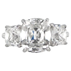 GIA Certified 5.33 Carat Cushion Cut Diamond Three-Stone Ring in Platinum