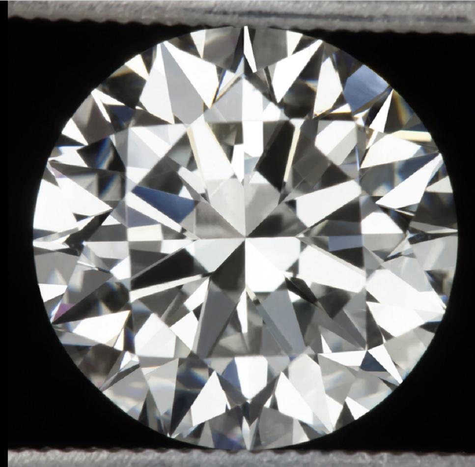 This dazzling and impressively large 2 carat GIA certified triple excellent diamond ring is very high quality with excellent Si1 clarity, beautiful D white color, and absolutely phenomenal sparkle! 

The main stone diamond has a huge spread and a