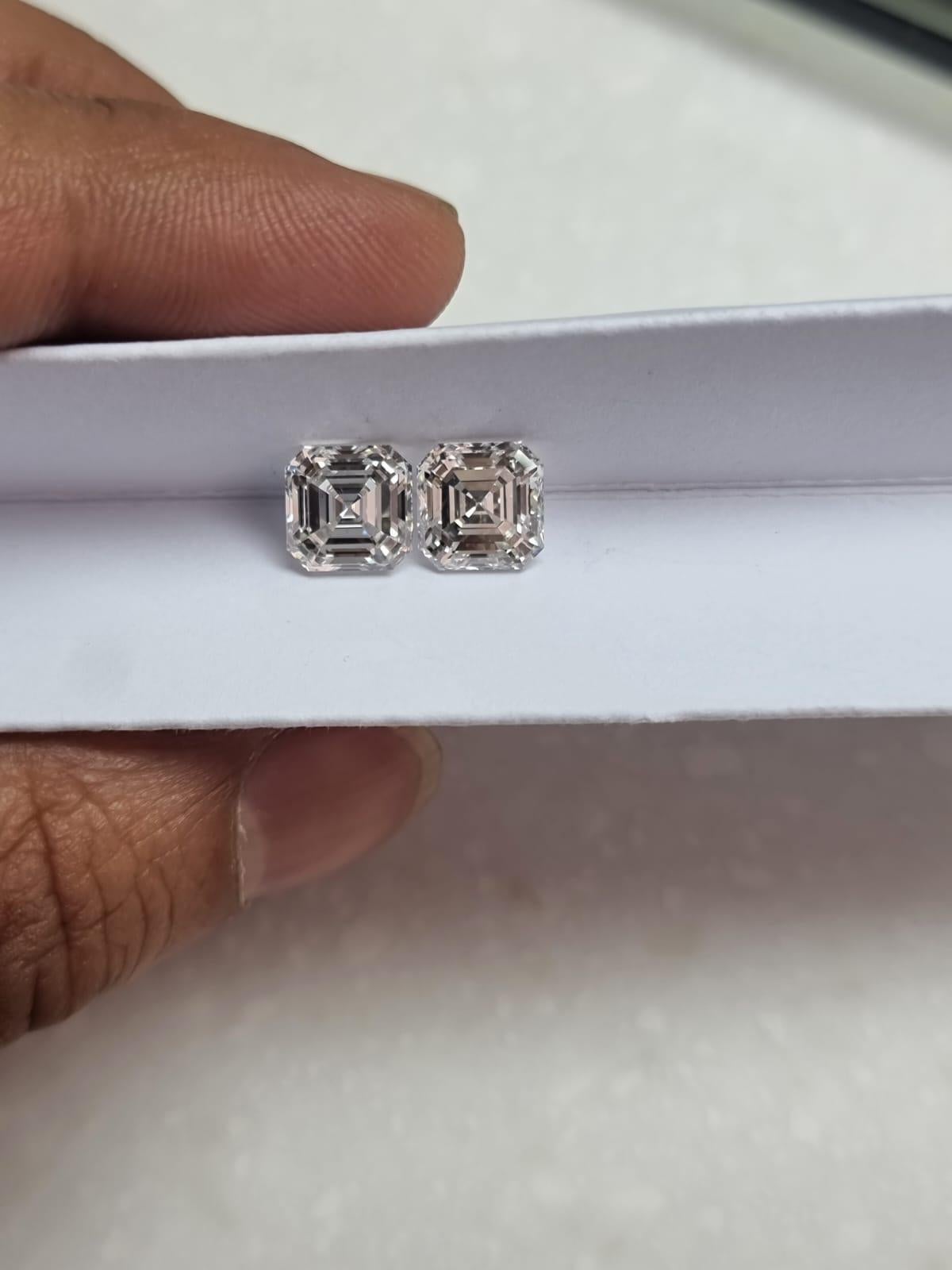 A stunning pair of GIA certified 5.40 carat (2.7 carat each) H color, VS2 clarity. Set in solid 18K White Gold. Comes with push-pull backing. We can customize the design. 