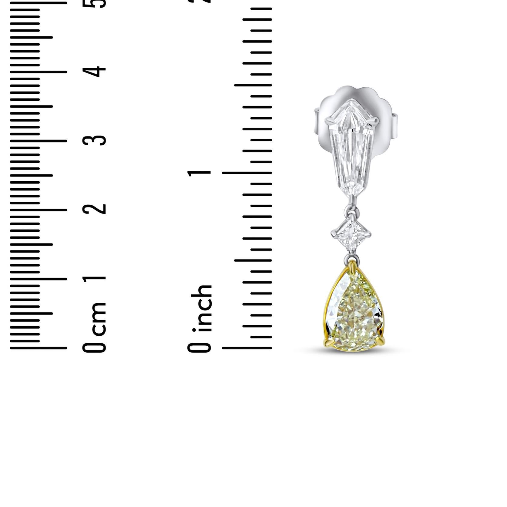 These exquisite dangle earrings feature a combination of kite and pear-shaped diamonds, elegantly connected by a princess-cut diamond. The left and right sides display a mirrored design with contrasting yellow and white patterns. 

Kite shape