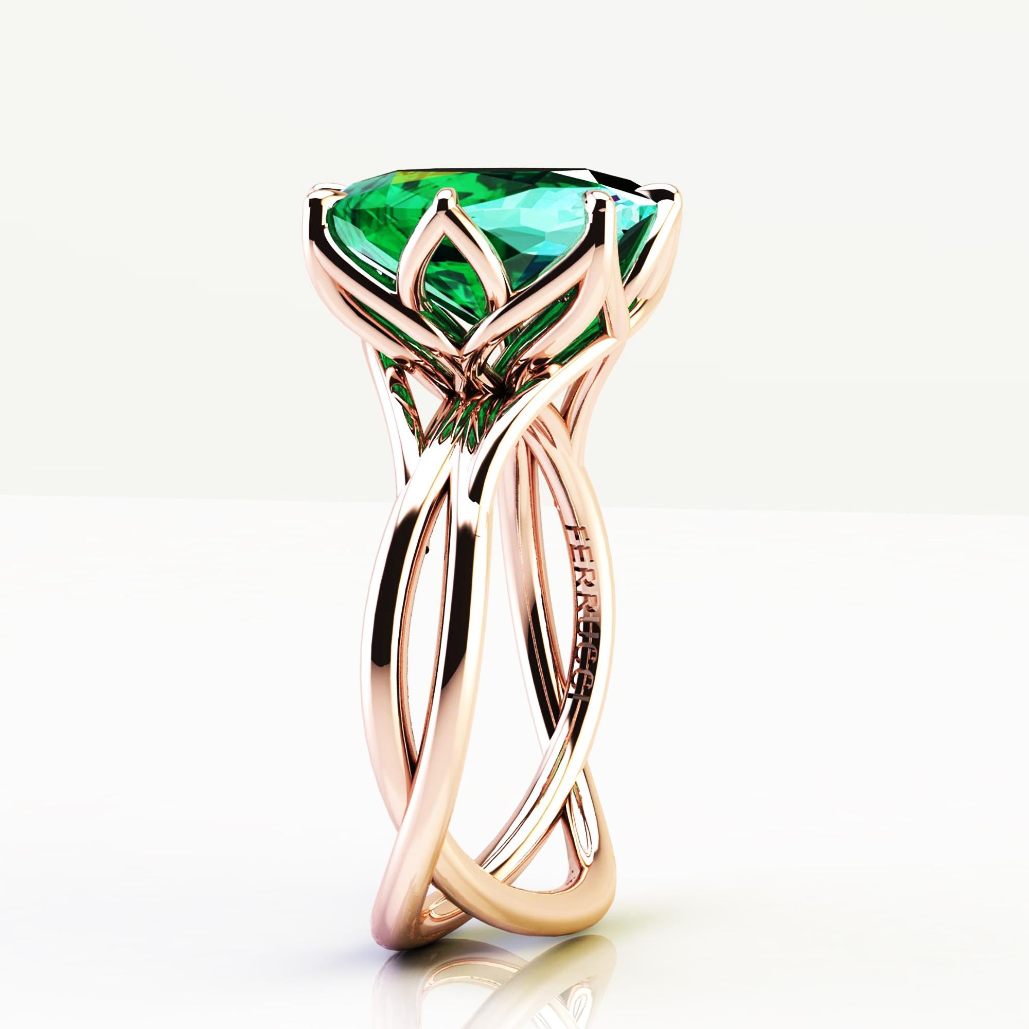 A Spectacular 5.42 carat natural Emerald of a deep green color, unique in its splendor, GIA Certified showing the minimal treatments applied, in a one of a kind, hand made 18k rose gold ring, designed and conceived in New York City. A design that