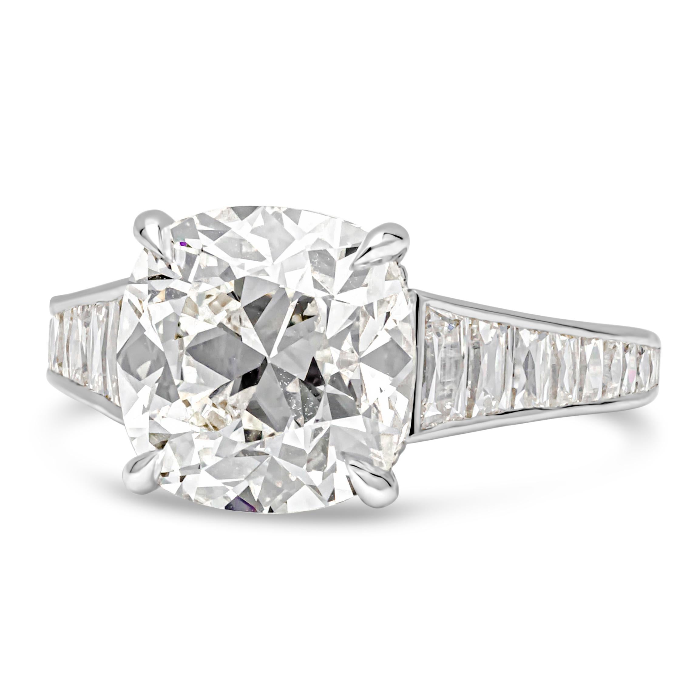 A stunning well-crafted engagement ring featuring a beautiful 5.42 carats cushion cut diamond that GIA certified as J color, VS1 in clarity, set in a classic four prong basket setting. Flanking the center diamond are 1.00 carats of tapered french