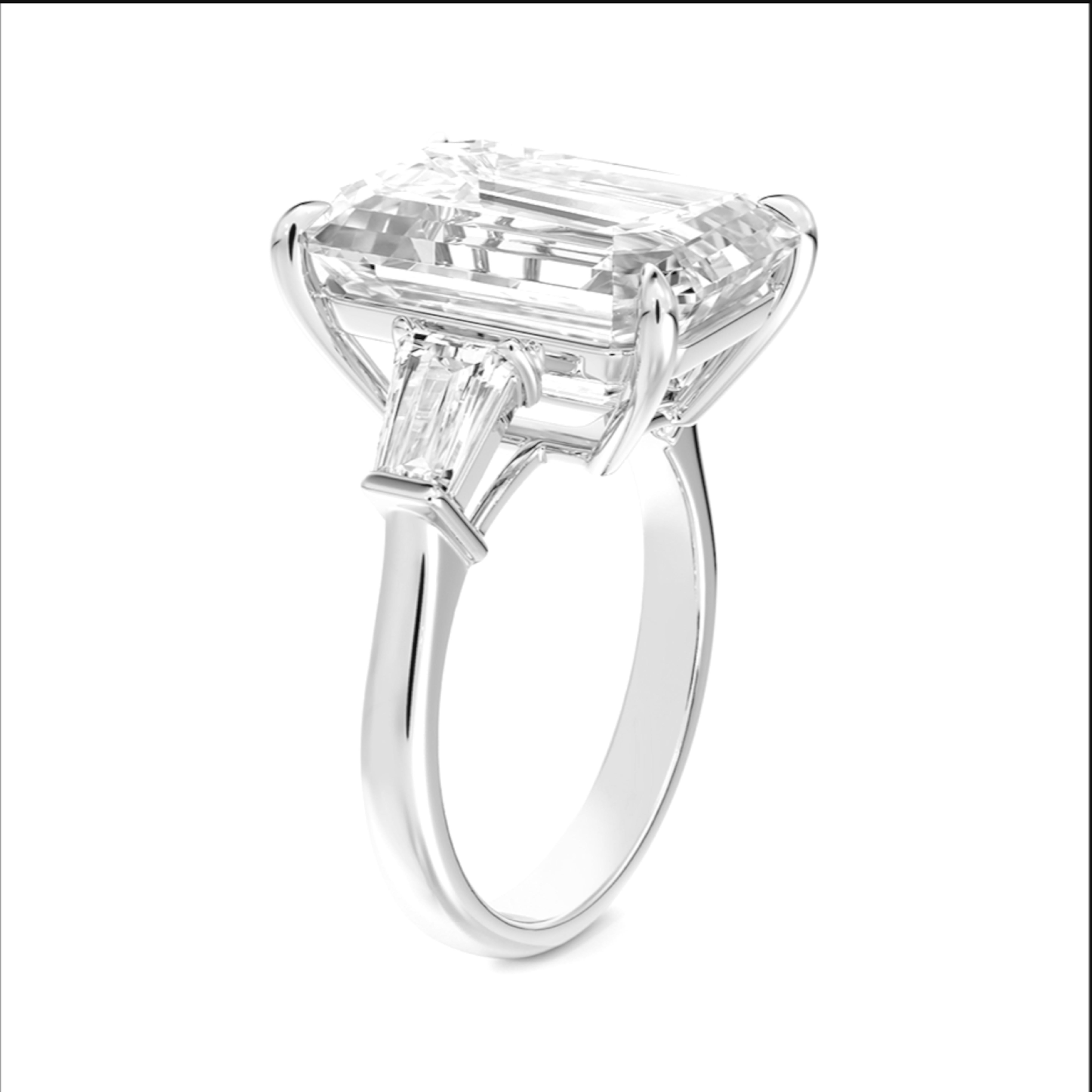 Diamant taille émeraude de 5,44 carats certifié GIA de couleur J et de pureté VVS2. Cela indique que le diamant est de très haute qualité, avec une transparence et une brillance excellentes. La taille émeraude renforce son élégance et sa