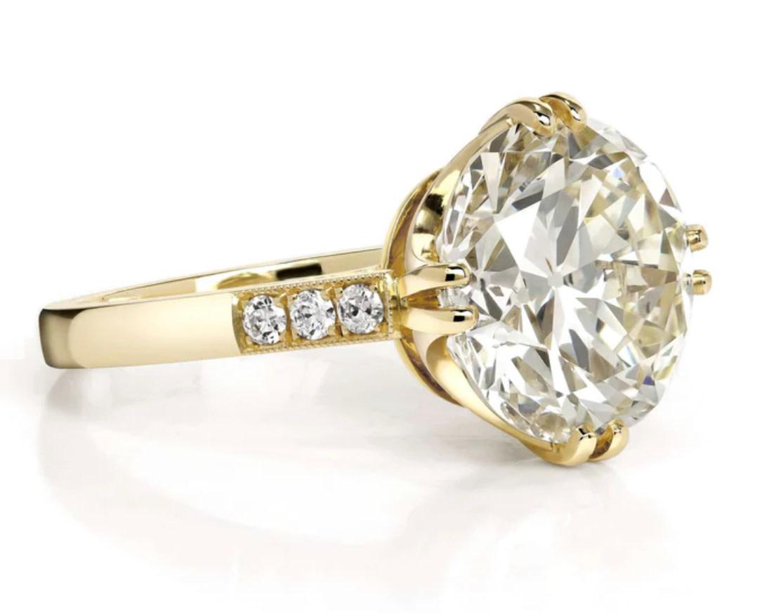 Old European Cut Diamond with 5.44ct Q-R/SI2 GIA certified with 0.11ctw old European cut accent diamonds prong set in a handcrafted 18K yellow gold mounting. The ring is handmade in LA by Single Stone. The ring has 2-speed bumps and can be resized.