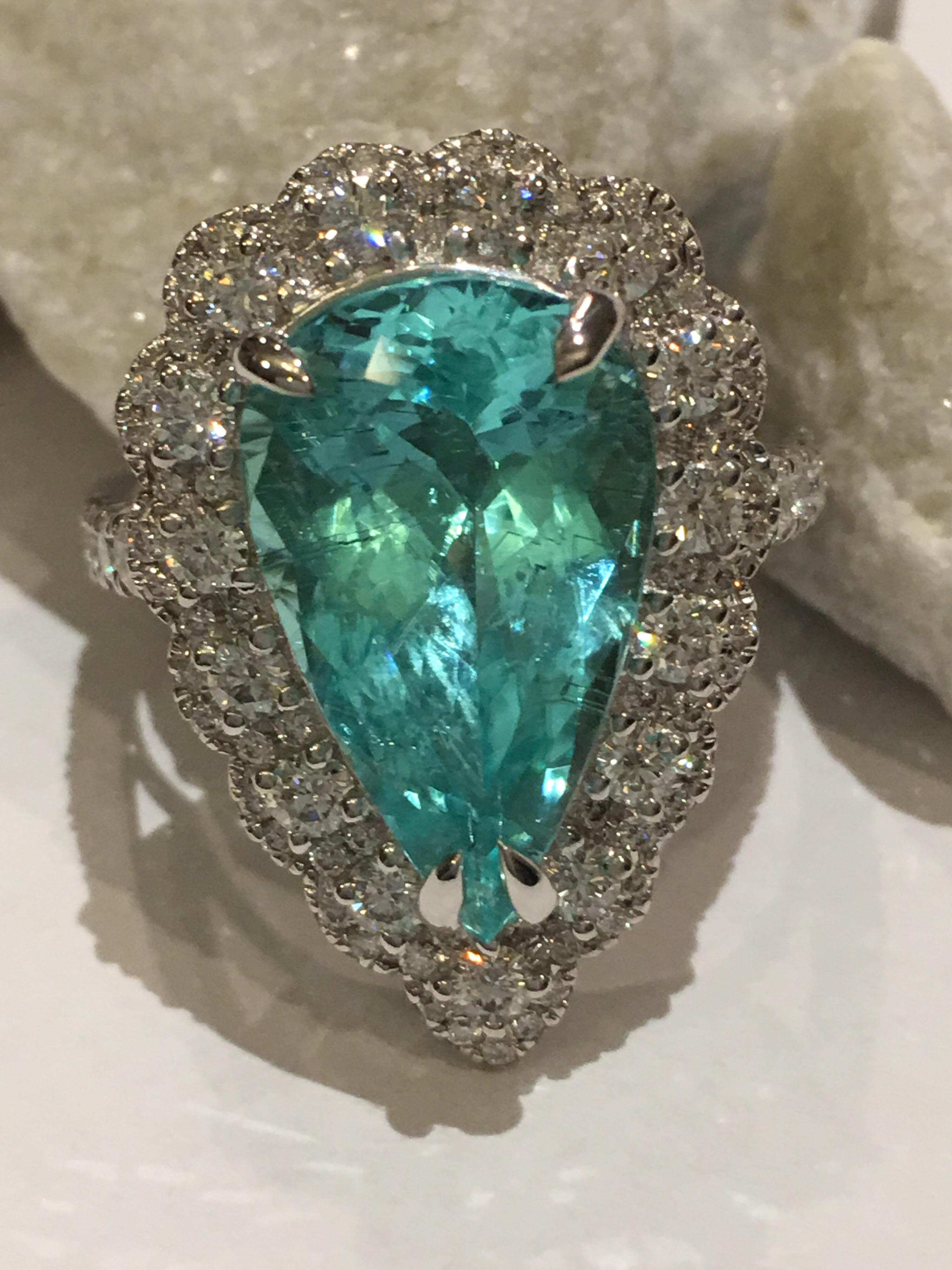 GIA Certified 5.44 Carat Paraiba Tourmaline Diamond Cocktail ring set in 18K White Gold.
White Diamonds total weight is 1.07 Carat.
The Size of the Ring is 7 but can be resized.