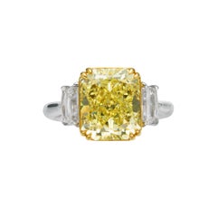 GIA Certified, 5.46ct Cushion cut Natural Fancy Yellow Diamond ring in 18KT Gold