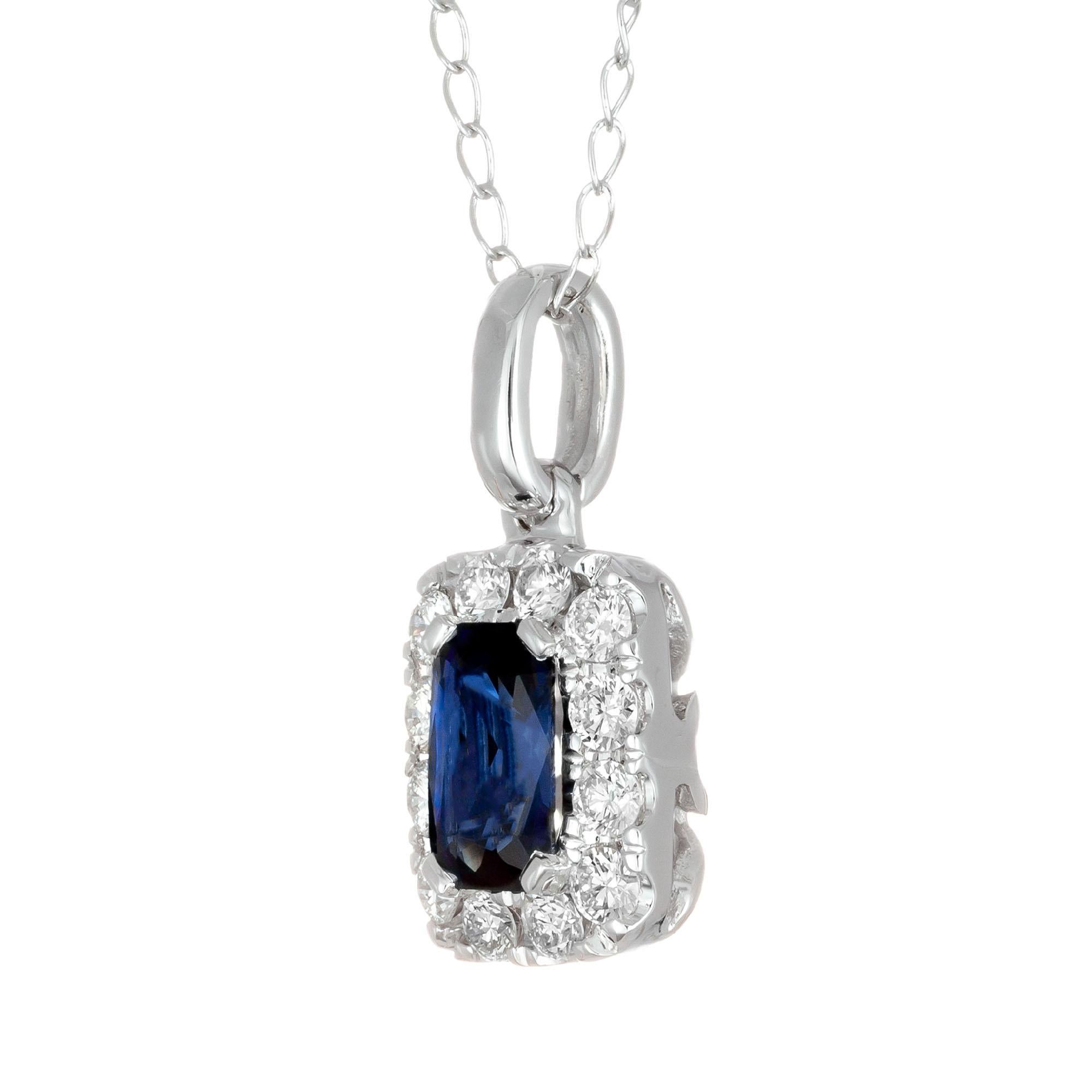 GIA certified Simple heat only, blue emerald cut sapphire and diamond halo pendant necklace in 14k white gold.

1 octagonal cut blue sapphire SI, approx. .55ct GIA Certificate # 52015578537
12 round brilliant cut diamonds G-H SI, approx. .25ct
14k