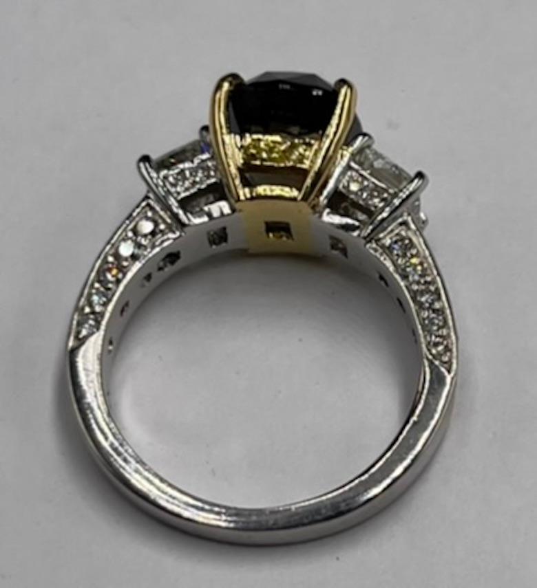 This is a custom one of a kind Platinum and 18K Gold Ring.  It is set with a beautiful Cushion Modified Brilliant Cut Natural Alexandrite with a GIA report. It is transparent with a gorgeous color change from Blueish Green To Purple. Alexandrite is
