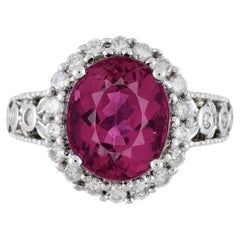 Anello con rubellite e diamante aureolato in filigrana certificato GIA da 5,52 carati