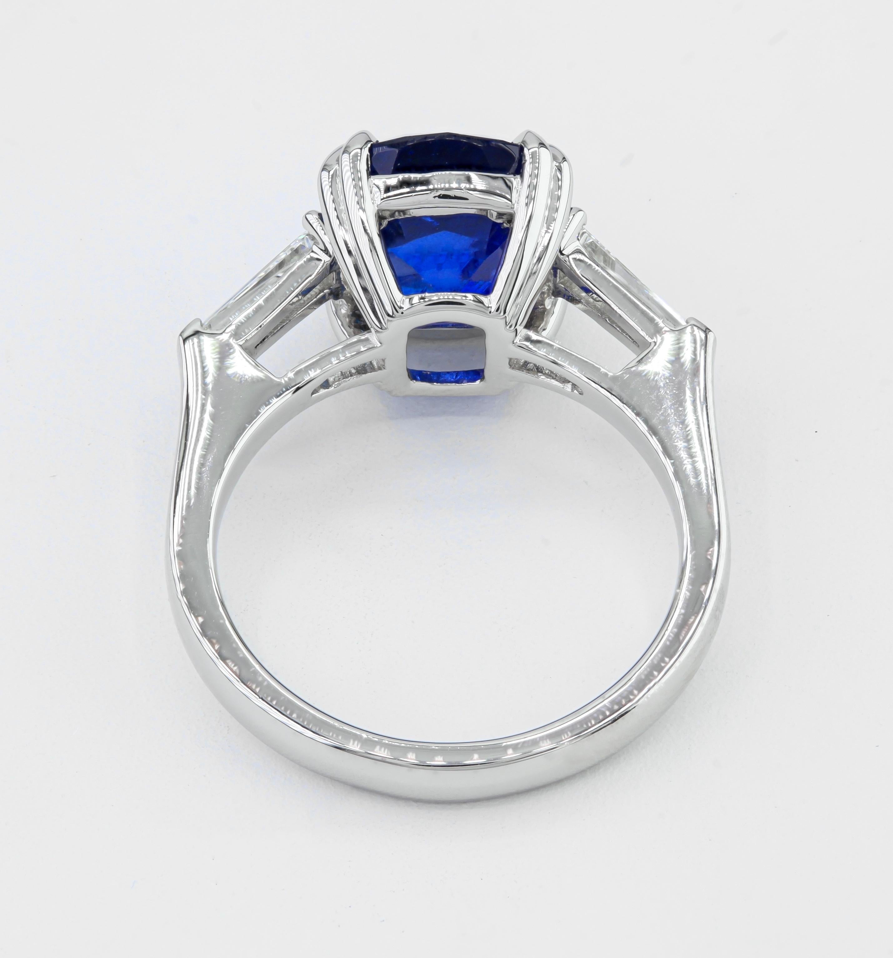 Modern GIA Certified 5.54 Carat Cushion Sapphire Three Stone Ring in Platinum For Sale