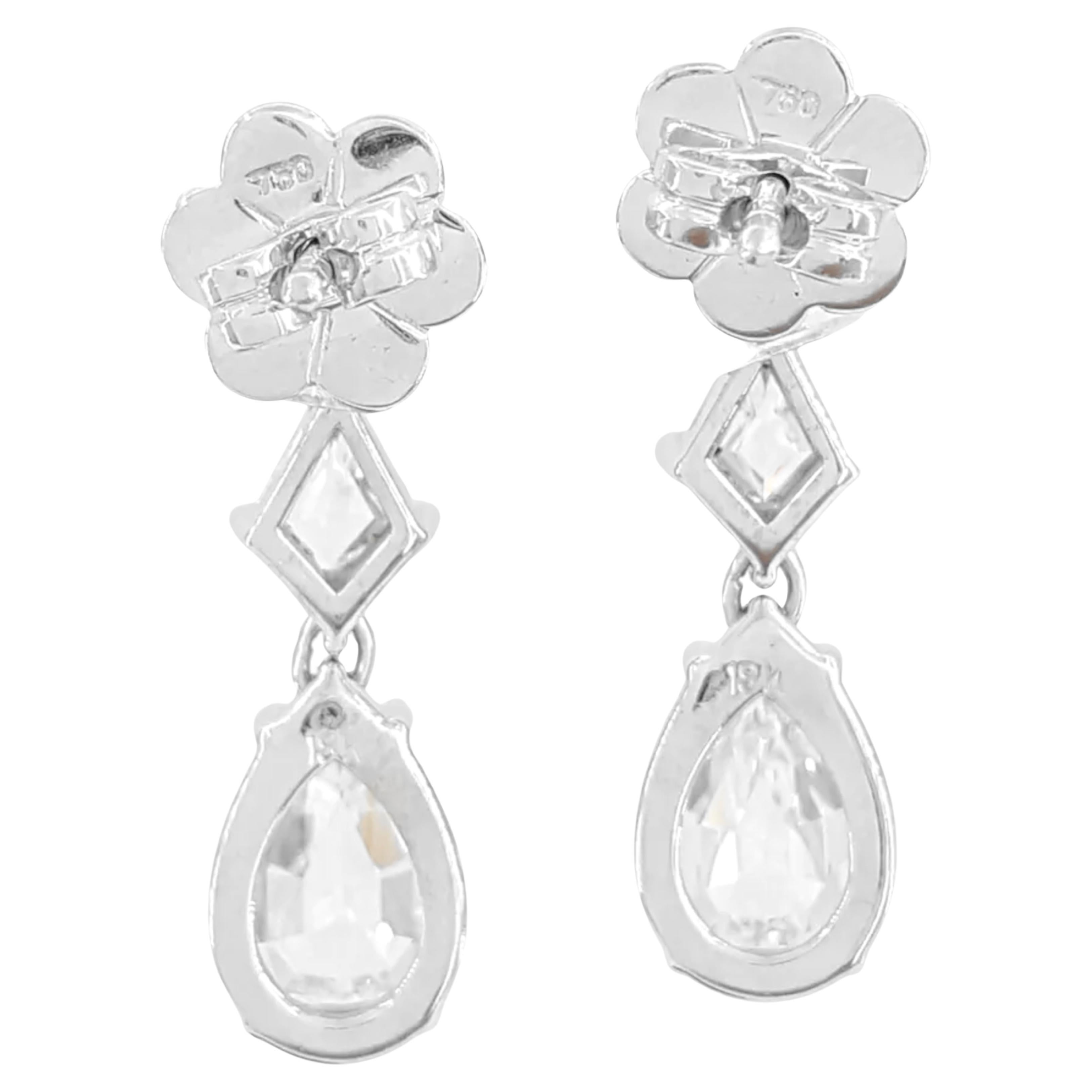 Diamond earrings feature a captivating total weight of 5.66 carats, showcasing six natural pear, shield, and kite cut diamonds. The diamonds are graded G-I in color and VVS1-VS2 in clarity, ensuring exceptional quality and brilliance.

The first