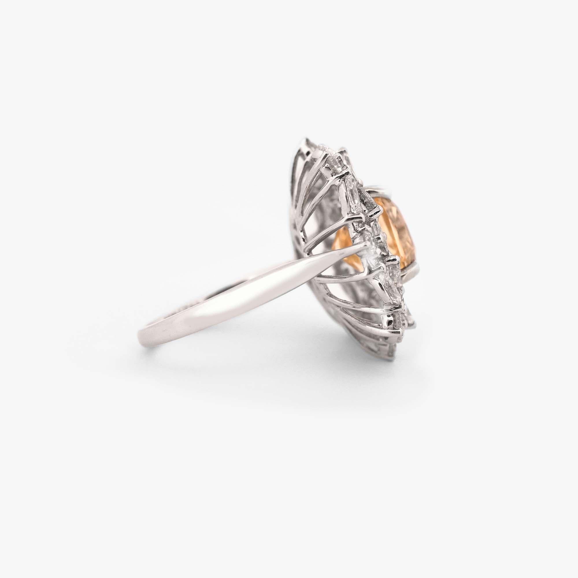 This breathtaking cocktail ring will capture the attention of everyone in the room. This stunning piece features a GIA certified 5.59 carat yellow sapphire, beautifully showcased in a elegant and stylish setting. The sapphire's vibrant and cheerful