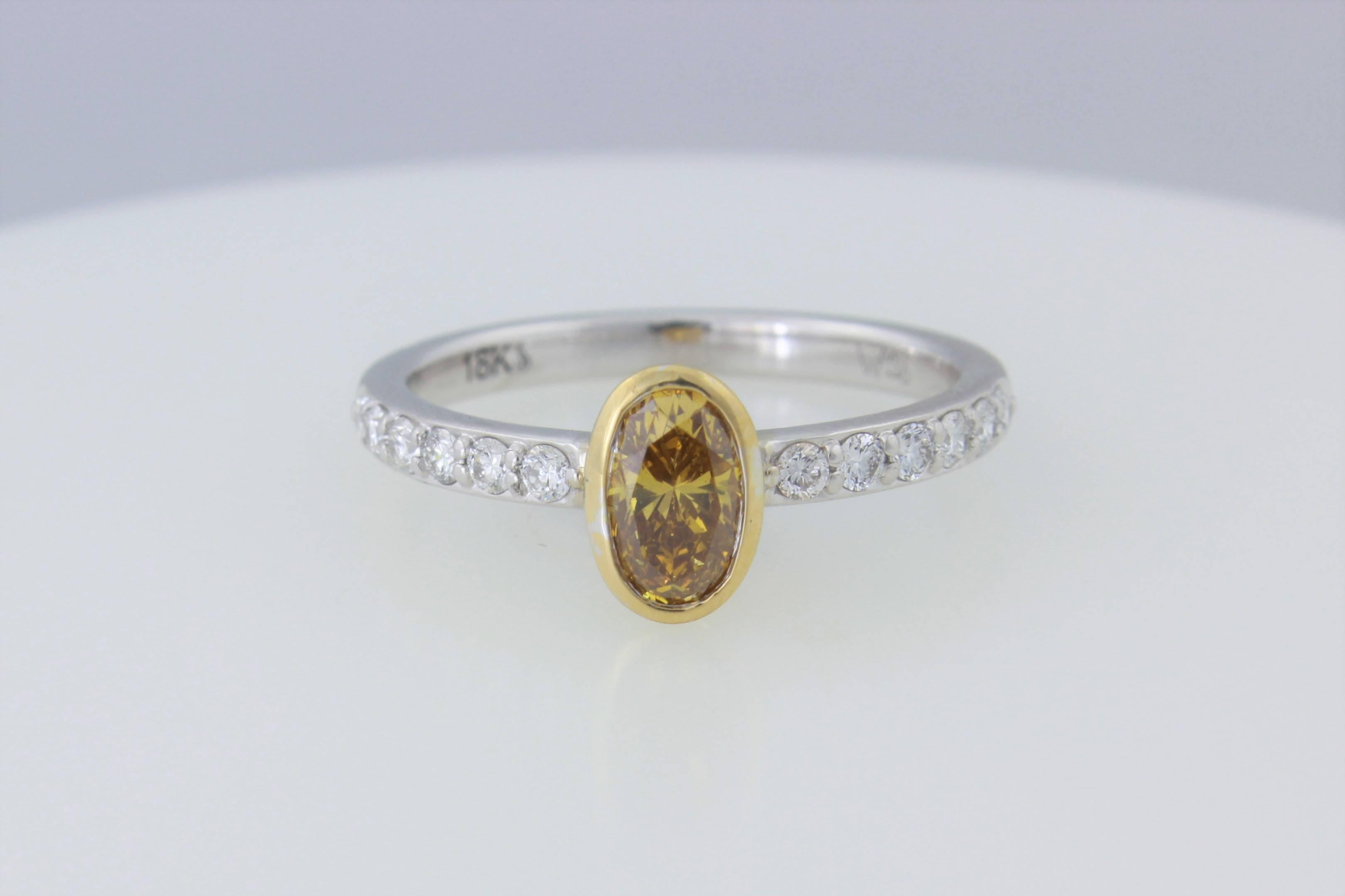 GIA Certified .56 ct Orange Yellow Oval Diamond In 18kt Two Tone Diamond Ring  In New Condition For Sale In Walnut Creek, CA