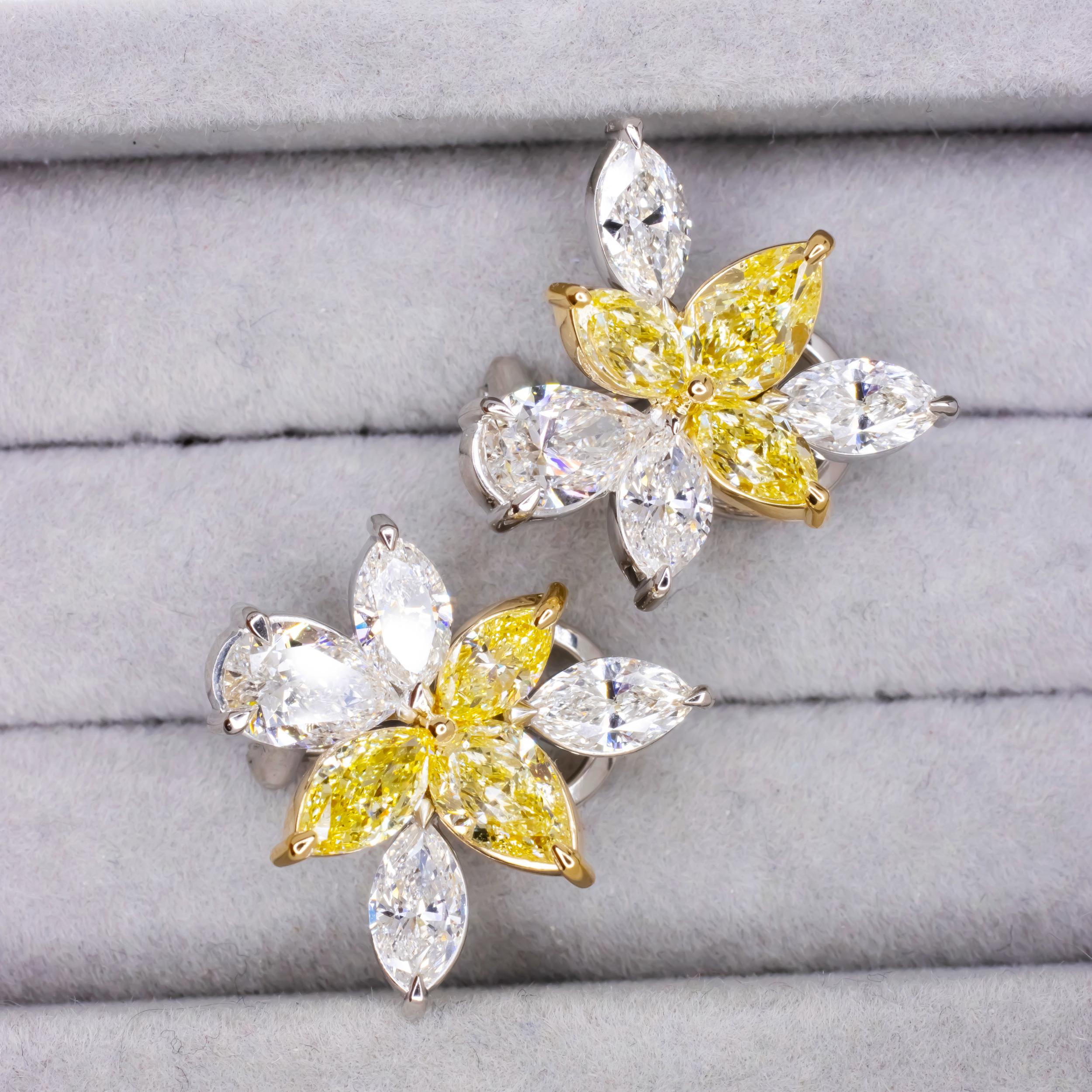 Indulge in the enchanting allure of these GIA Certified 5.60 Carat Fancy Yellow and White Diamond Platinum Cluster Earrings. A symphony of shapes unfolds as marquise and pear diamonds dance together, intricately set in platinum. Adding a touch of