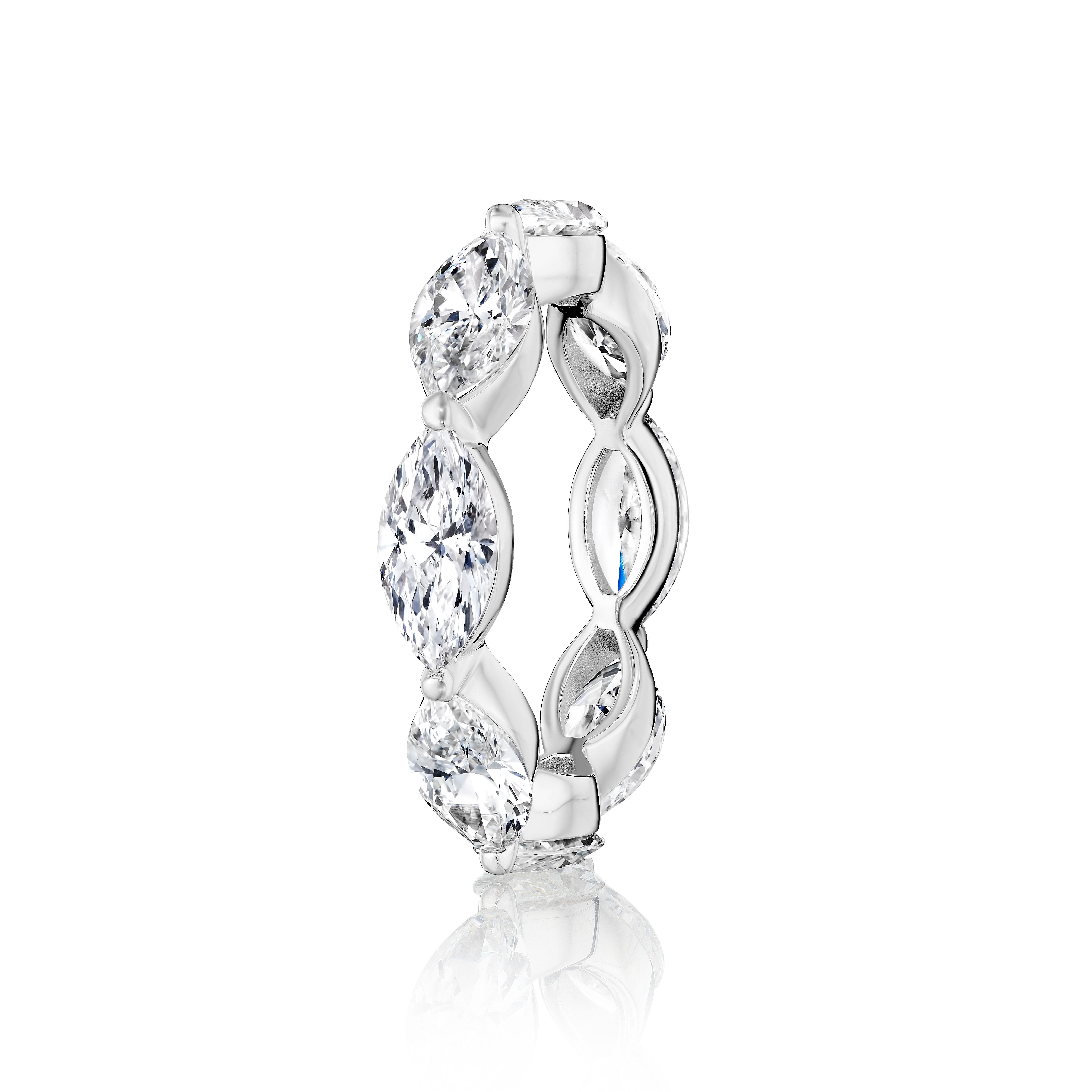 8 Perfectly matched and elongated Marquise Cut Diamonds weighing a total of 5.60 Carats.
Each stone weighs 0.70ct
Stones are DEF color and SI Clarity.
Every stone is certified by GIA.
Set in Platinum.
Size 6.