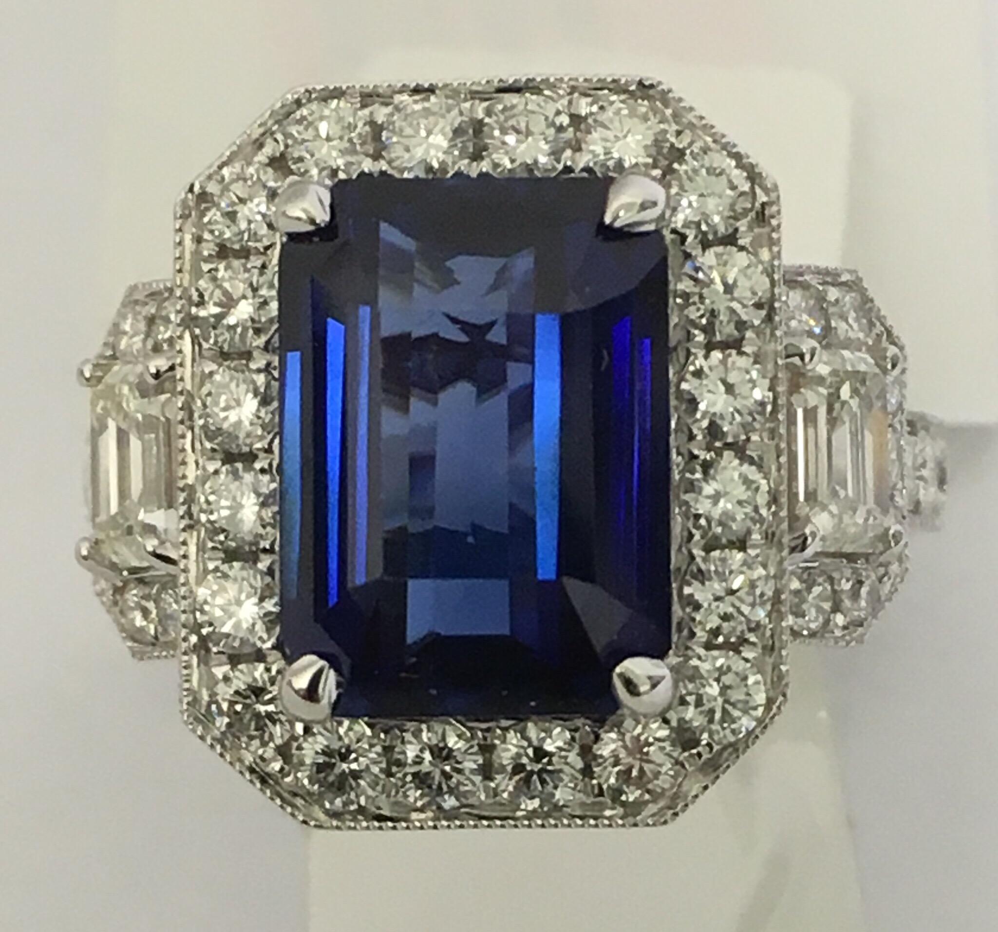 Octagon 5.60 Carat Blue Sapphire is Even color blue sapphire set in 18 Karat white Gold. Additional 1.81 Carat white diamonds. All the diamonds are matched full cut  and VS quality. The ring is handcrafted one of a kind.
Size of the ring is 7 (Can