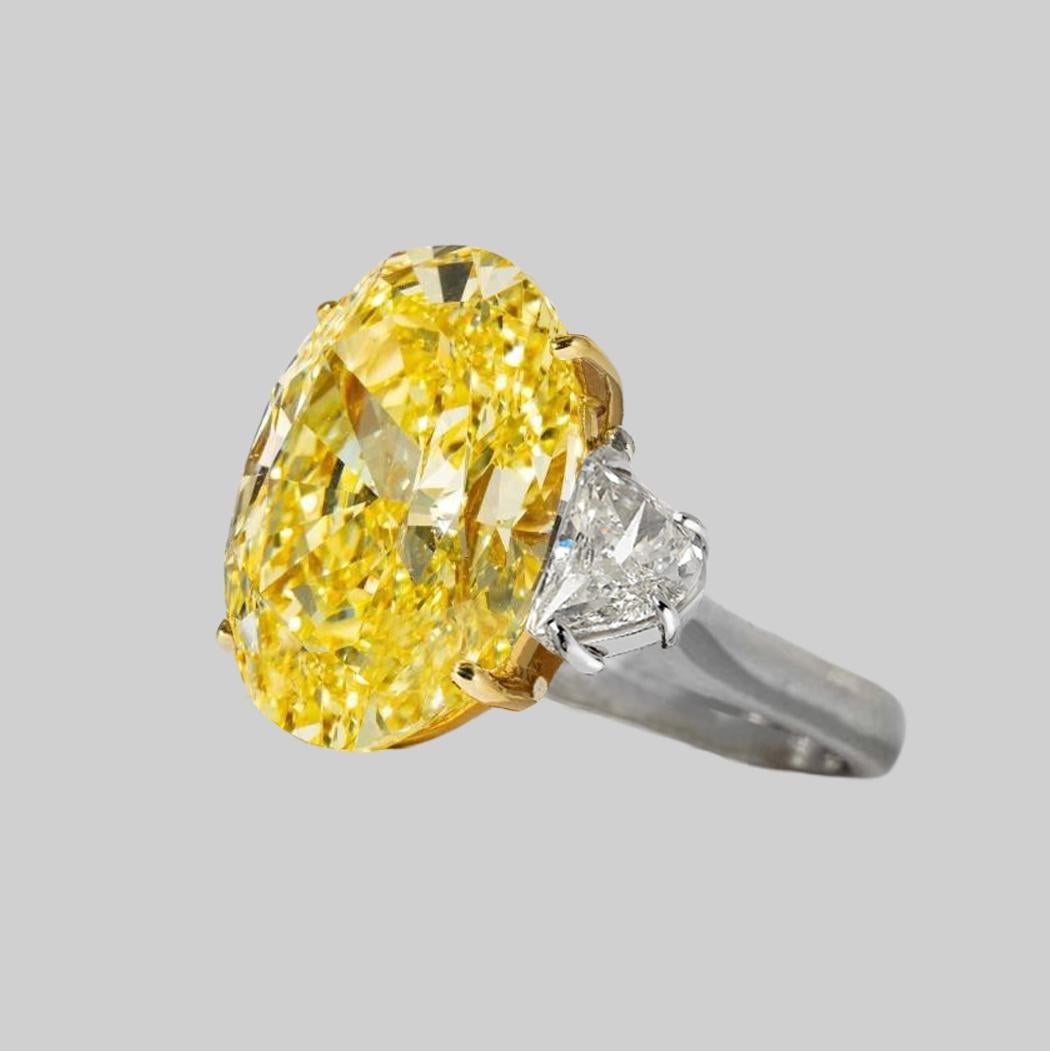 GIA Certified 5.65 Carat Fancy Light Yellow Oval Three Stone Diamond Ring

This outstanding 5.65 carat fancy intense yellow Oval Diamond is  certified by GIA (see certificate picture for detailed stone information), and set in a hand-made 18k yellow