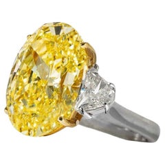 GIA Certified 5.65 Carat Fancy Light Yellow Oval Three Stone Diamond Ring