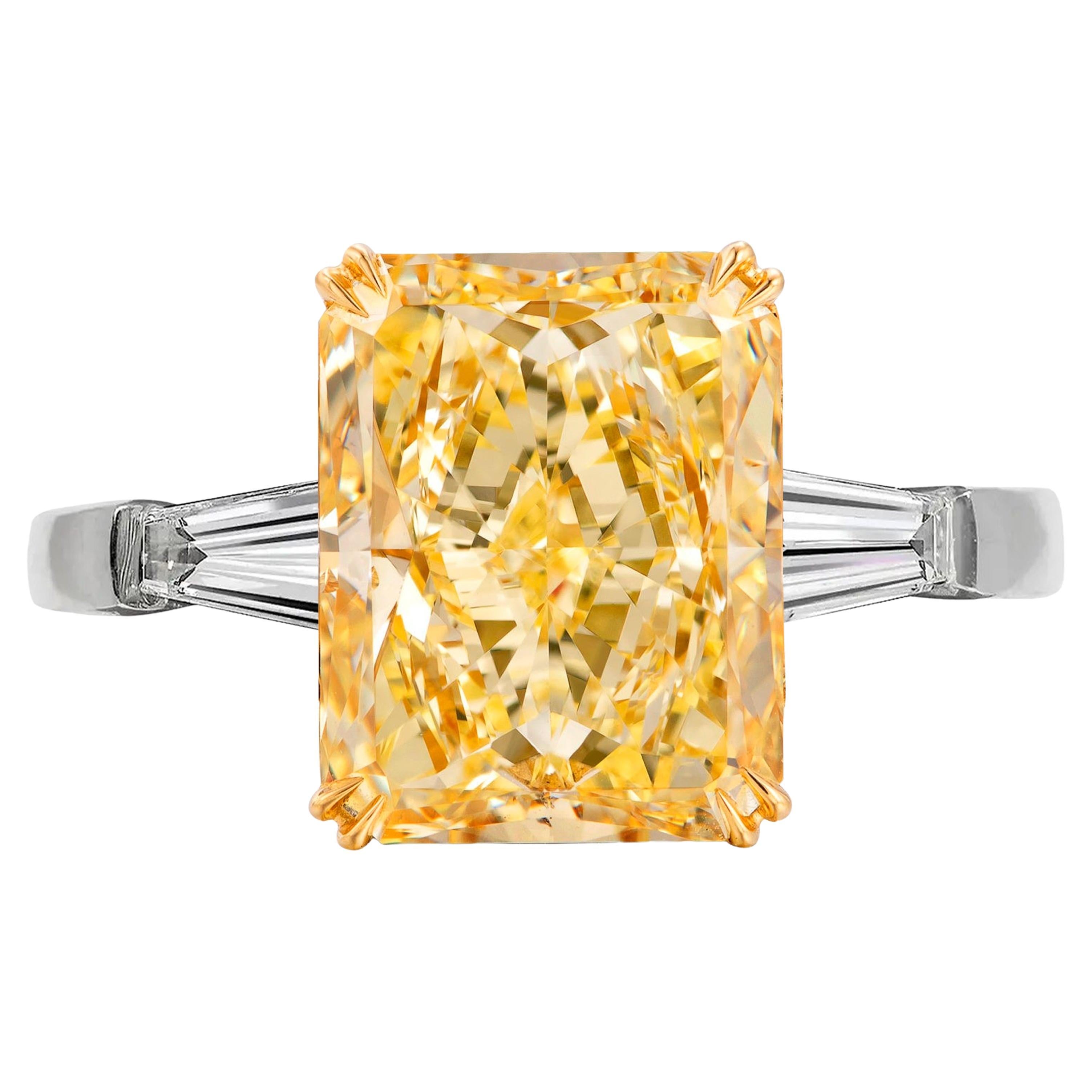 GIA Certified 5.65 Carat Fancy Yellow Radiant Diamond Tapered Baguette Ring For Sale