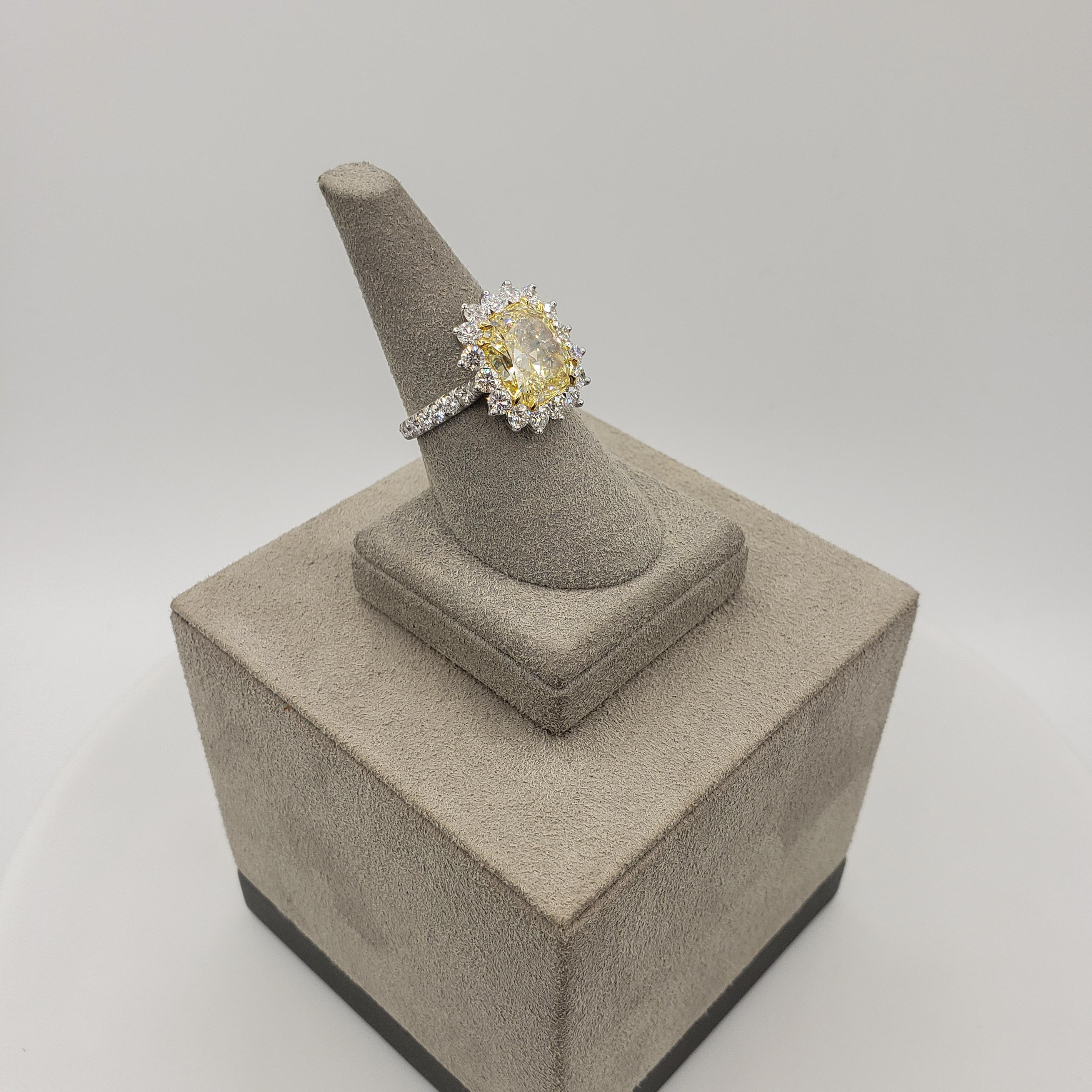 GIA Certified 5.66 Carat Radiant Cut Yellow Diamond Halo Engagement Ring In New Condition For Sale In New York, NY