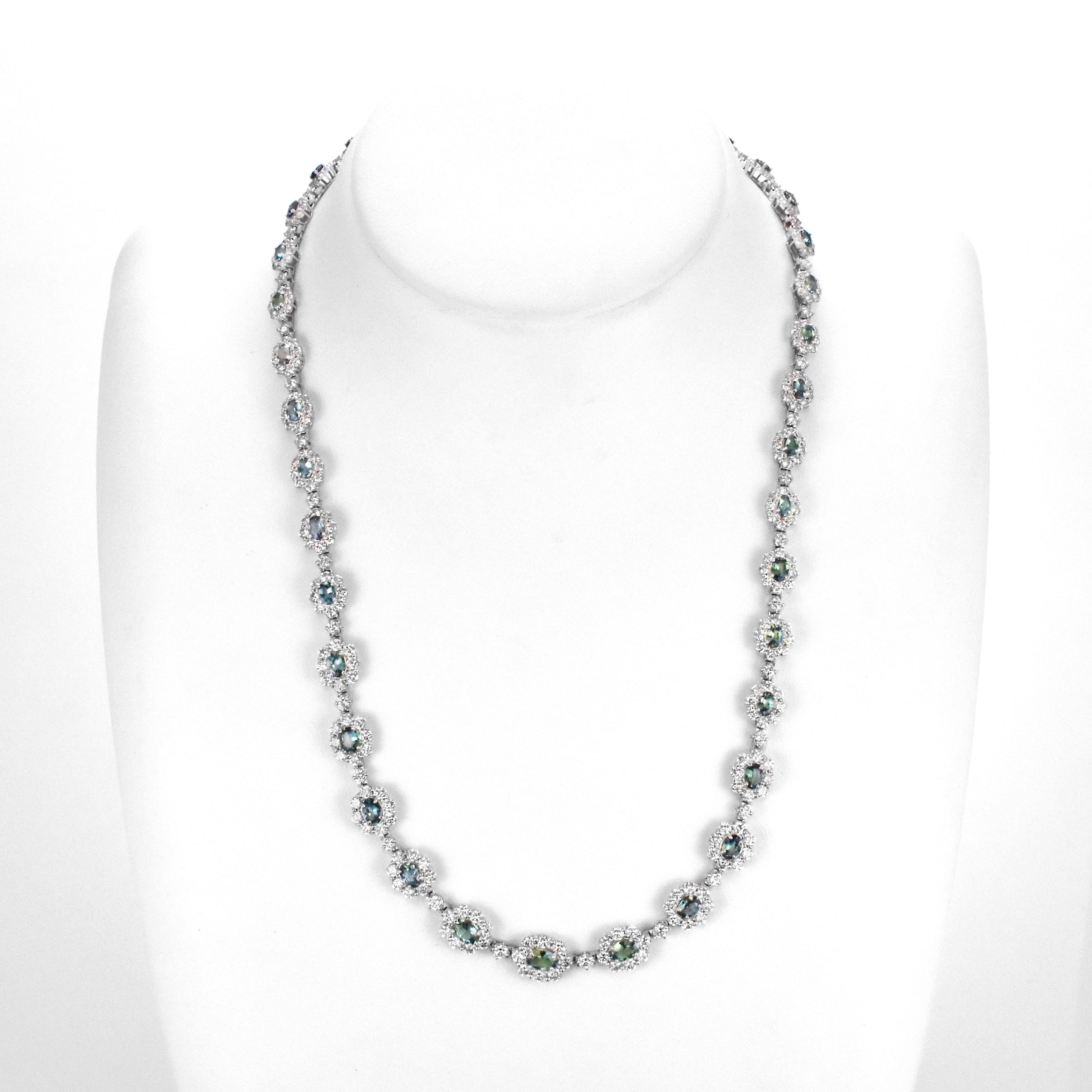 A gorgeous necklace featuring a total 5.67 Carats Natural Brazilian Alexandrites and 8.01 Carats of Diamond Accents made in Platinum. Alexandrites produce a natural color-change phenomenon as they exhibit a Bluish Green Color under Fluorescent Light