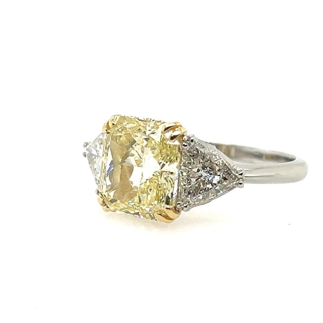 A Magnificent 4.15 carat GIA certified Natural Fancy Light Yellow Radiant Cut Diamond Platinum and 18k Gold Ring. 

The stone measures 9.93x9.27x5.28mm (looks like a five carat stone). The color is very strong for its grading and the SI1 clarity is