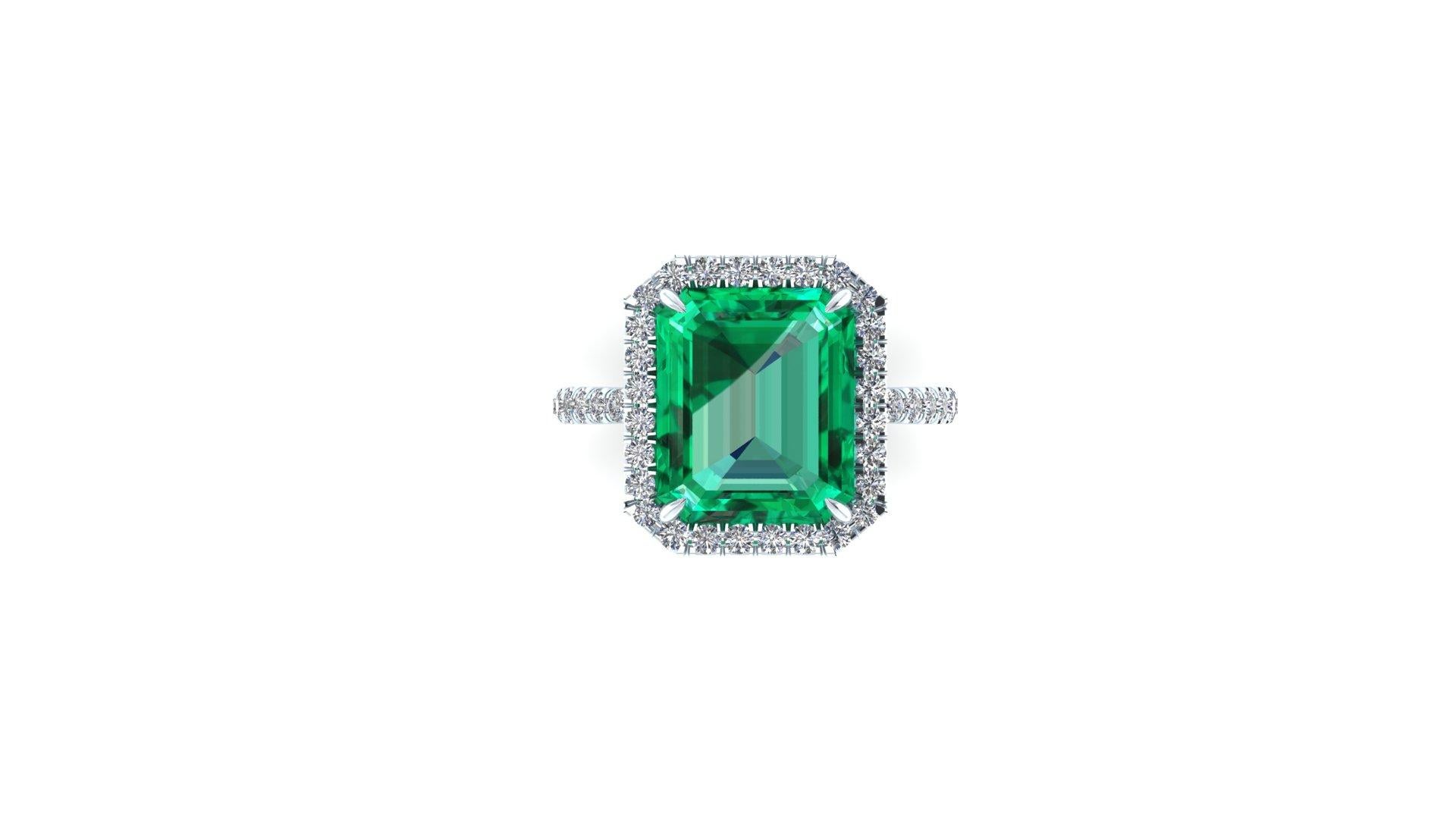 5.75 ct Emerald, GIA Certified stunning clean mineral, with only a few natural inclusions typical of the Emerald. 
Diamond's Halo and Diamond pave' set on the shank, for an approximate total carat weight of 0.65 carats, G color, VS clarity,
made in