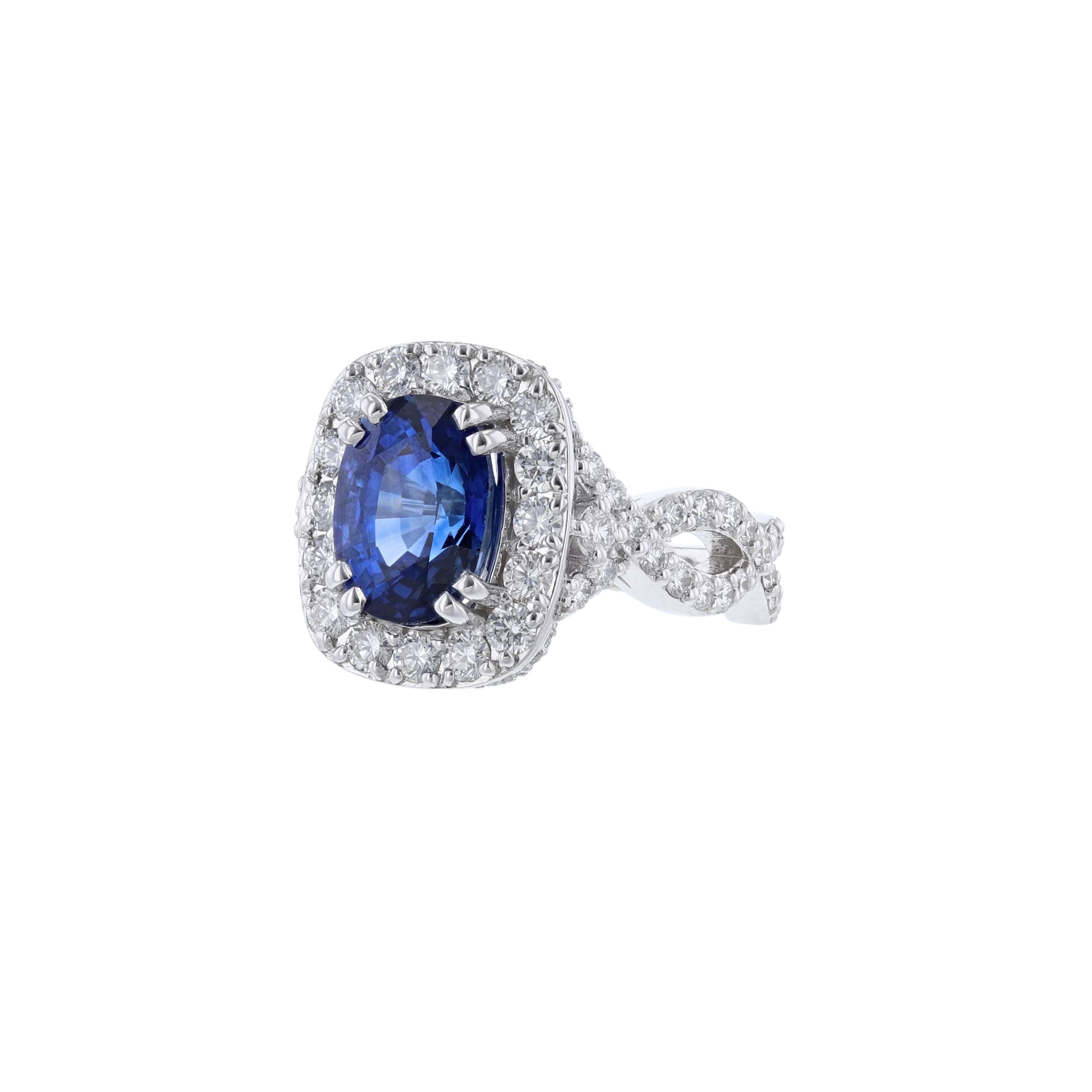 This ring is made in 14K white gold and features 1 oval-cut, natural corundum, blue sapphire from Madagascar weighing 1.42 carats. The stone is GIA certified with GIA 2205469297. Surrounded by 92 round cut diamonds weighing 1.59 carats. With a color