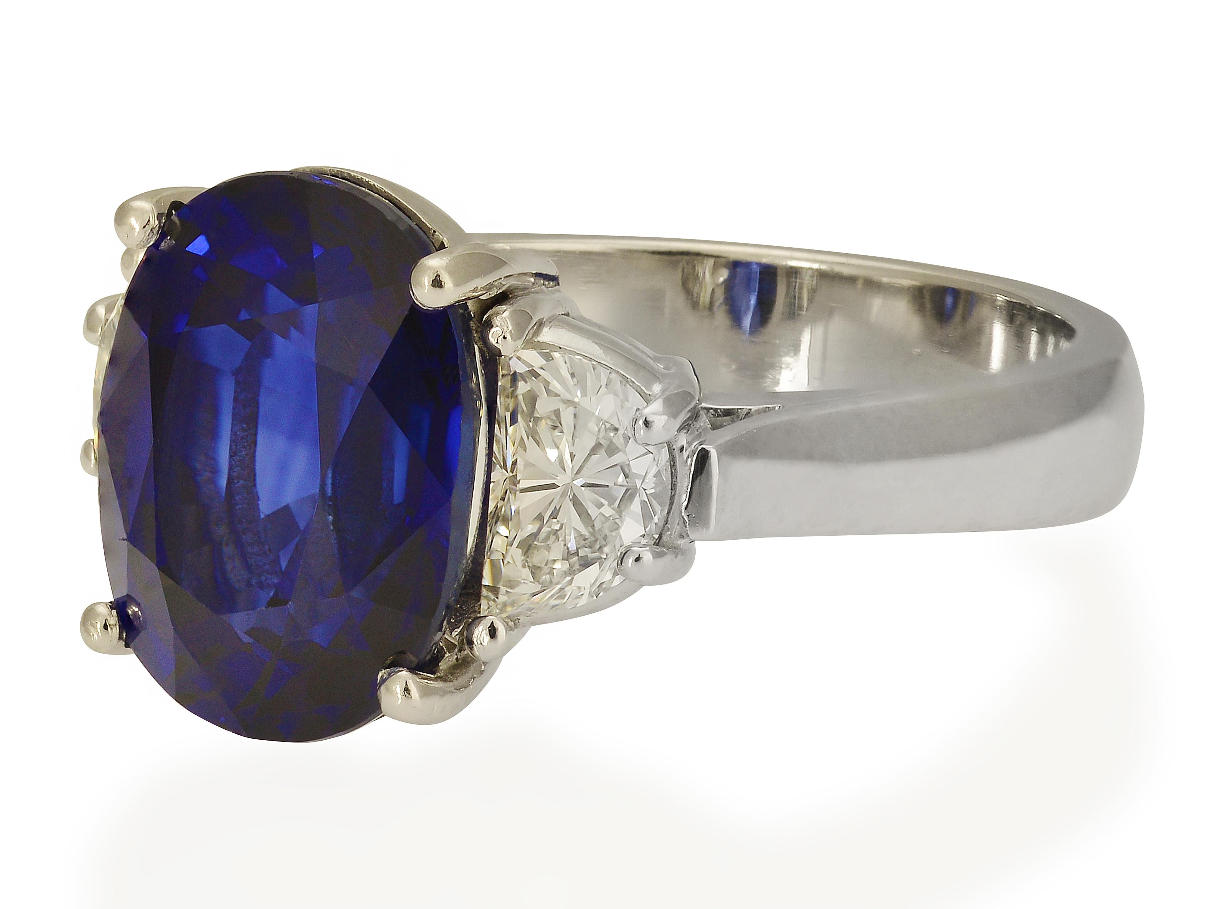 Platinum Cocktail 3 Stone Ring Featuring a Prong Set 5.93 Carat Oval Sapphire GIA Graded as Natural, Heated, 