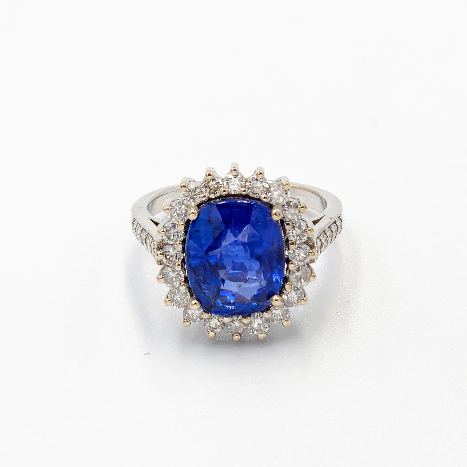 This is a beautiful GIA certified Velvet Blue Sapphire Ring with diamonds and 18k gold. It is a beautiful and amazing piece with velvet Blue color, set in a custom designed ring to enhance its natural beauty!
Blue Sapphire : 5.18 carats
Certificate: