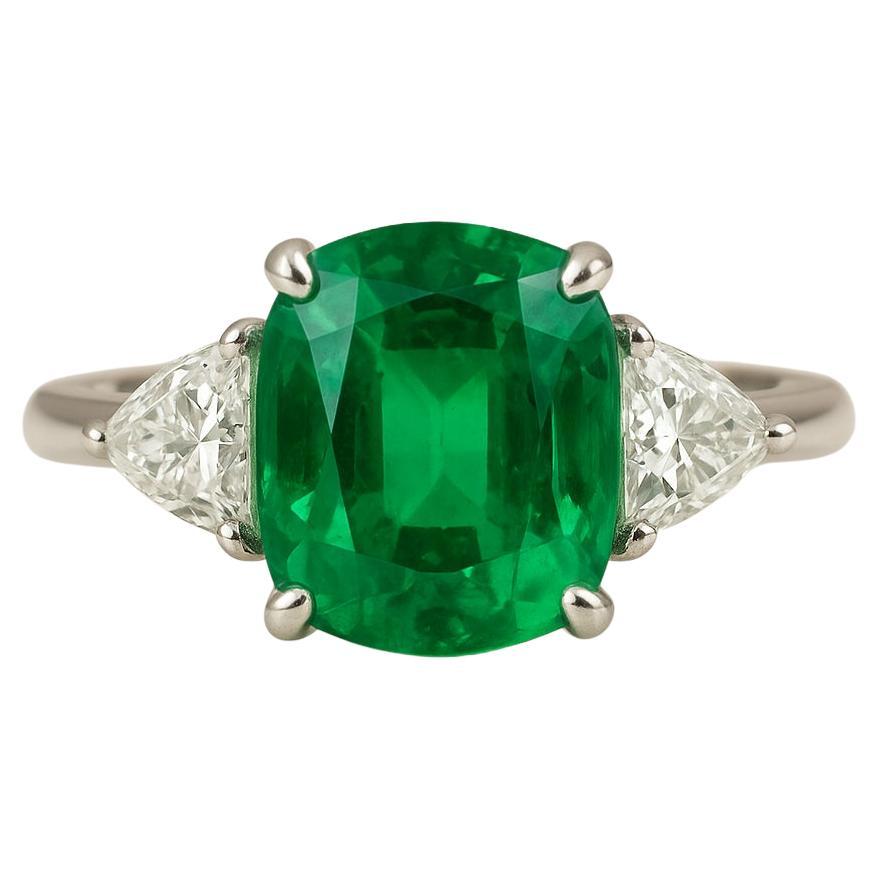 GIA Certified 6 Carat Cushion Cut Emerald and Diamond Three-Stone Platinum Ring