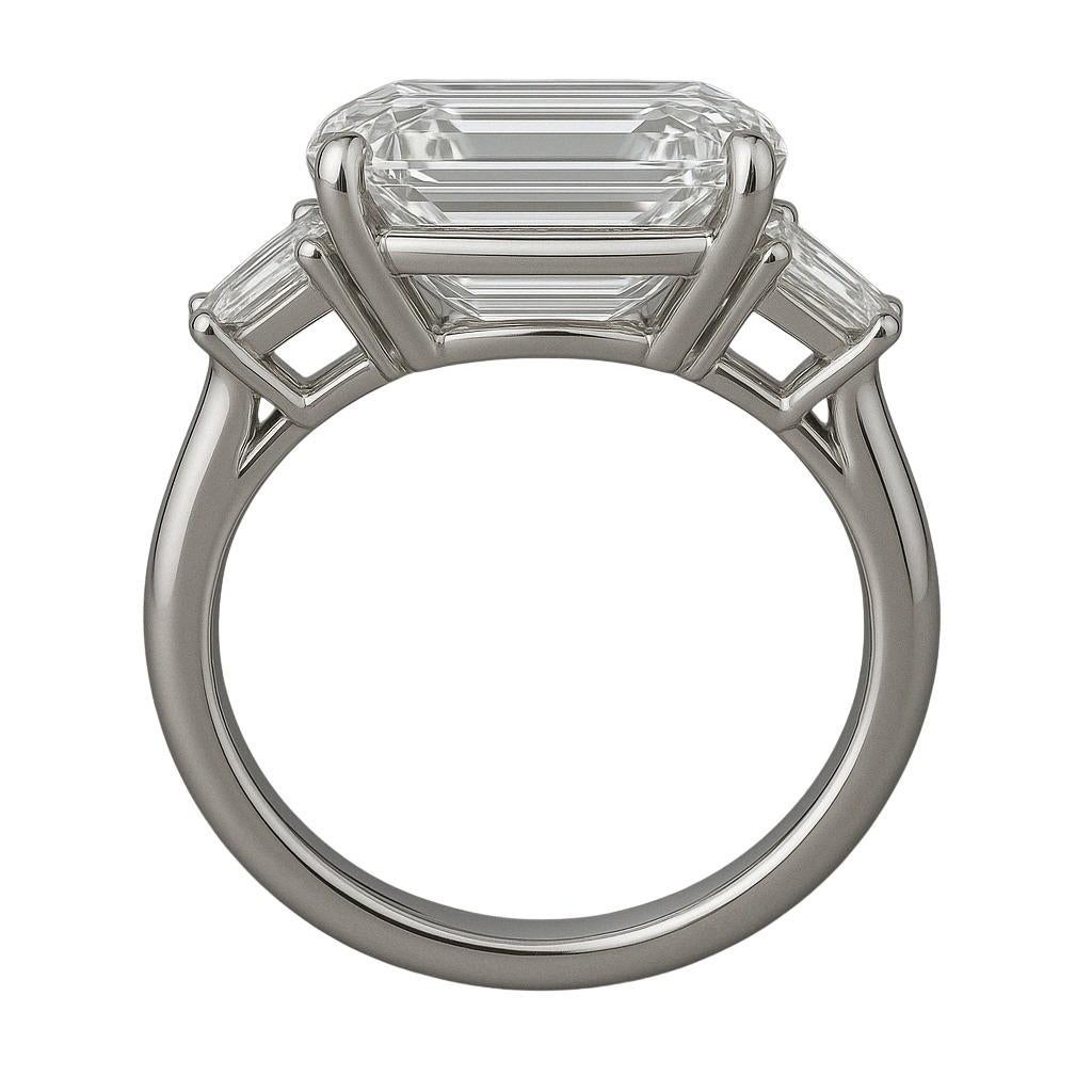 This exquisite platinum ring showcases a stunning GIA certified 6.02 carat emerald-cut diamond, gracefully flanked by two perfectly matched trapezoid-cut side stones, all set in a modern and elegant three-stone design.

The center diamond boasts a G
