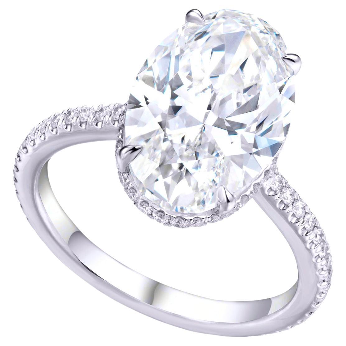 GIA Certified 6 Carat Oval Cut Diamond Solitaire Ring in Platinum with Pavè For Sale