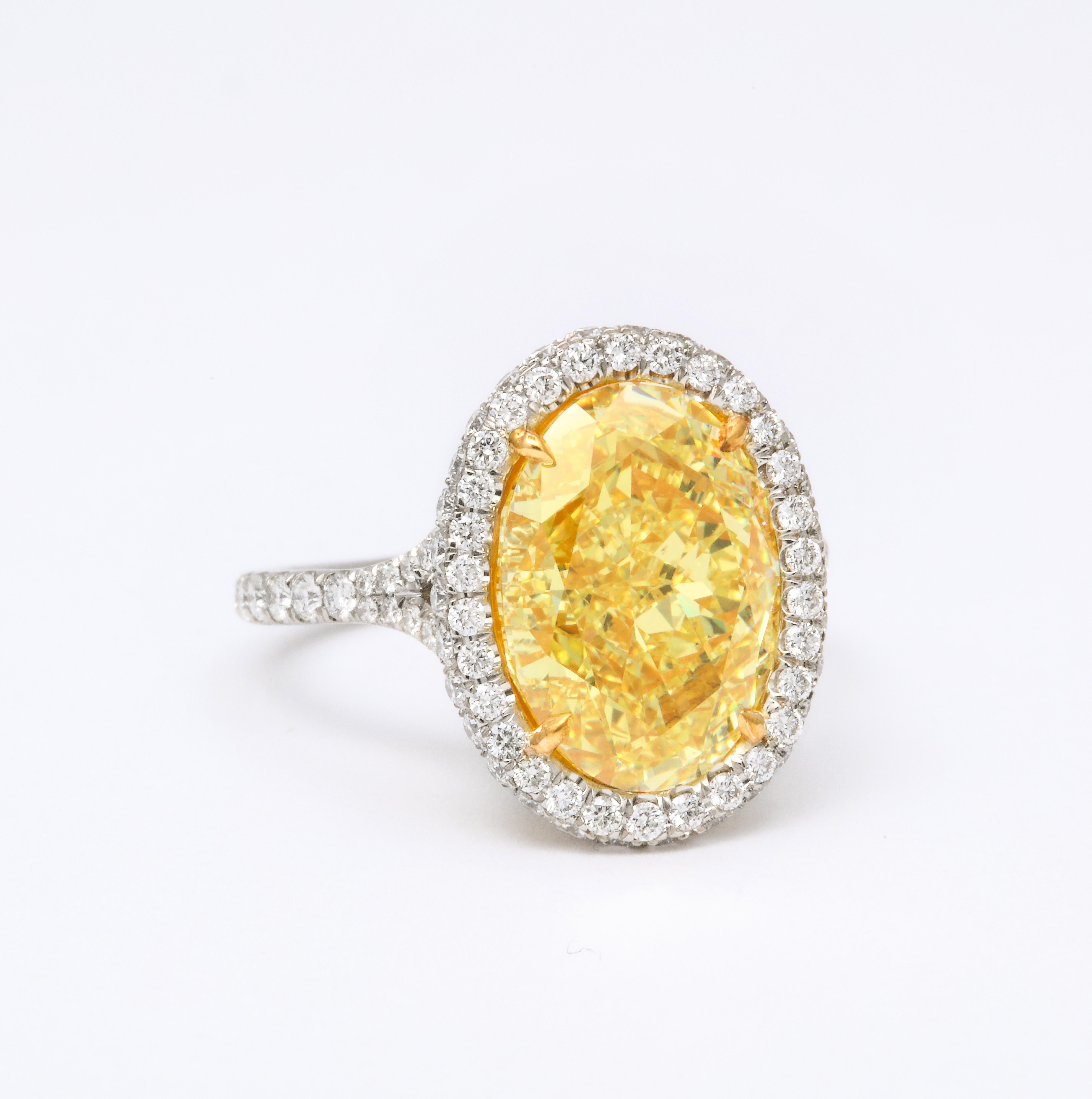 
A FABULOUS yellow diamond ring with deep vibrant yellow color!

GIA Certified 5.05 carat Fancy Yellow, VS2 center diamond. 

Set in a custom, platinum mounting with .85 carats of white round brilliant cut diamonds.

The center diamond measures like