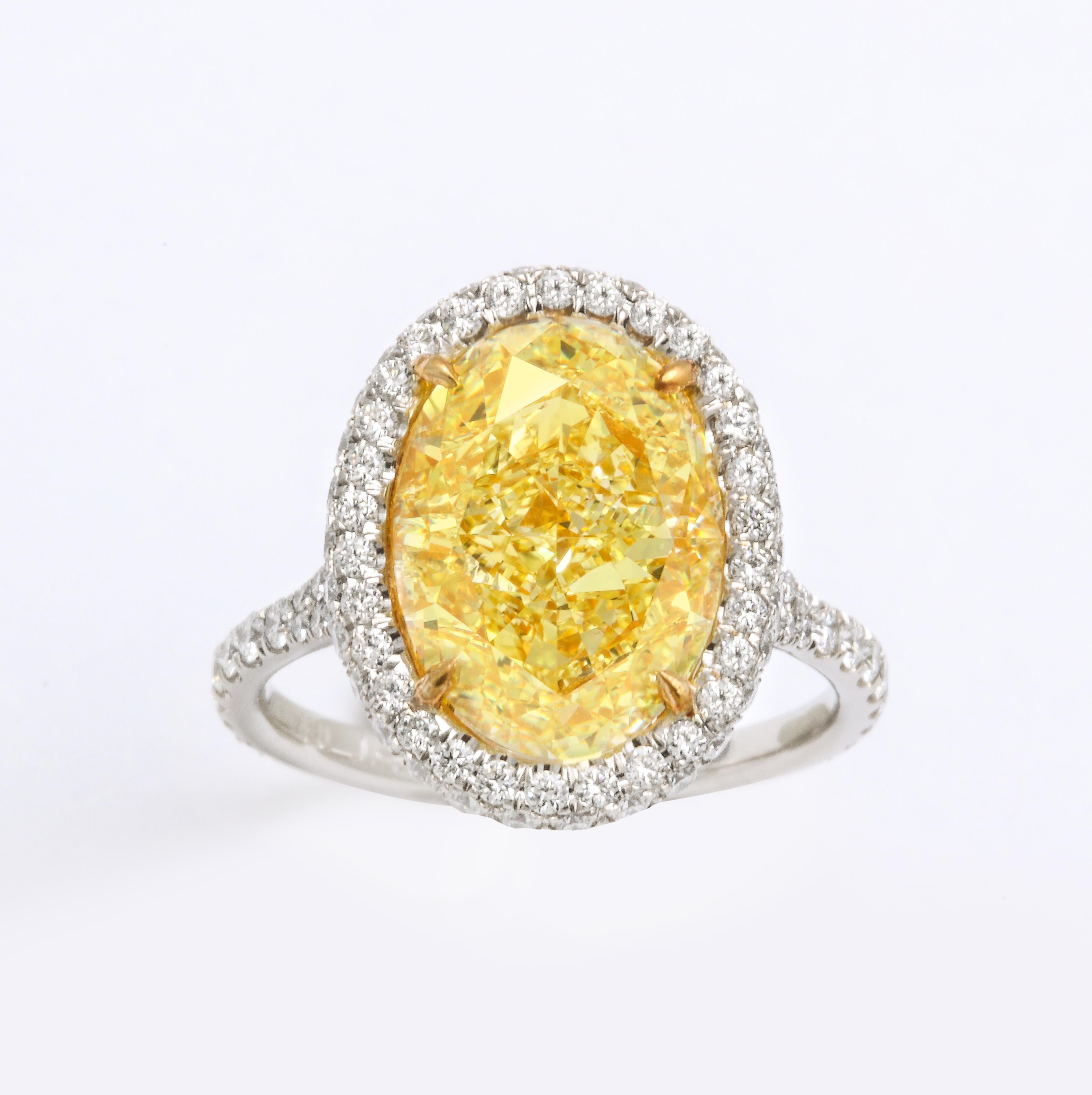 Oval Cut GIA Certified 5 Carat Oval Fancy Yellow Diamond Ring For Sale