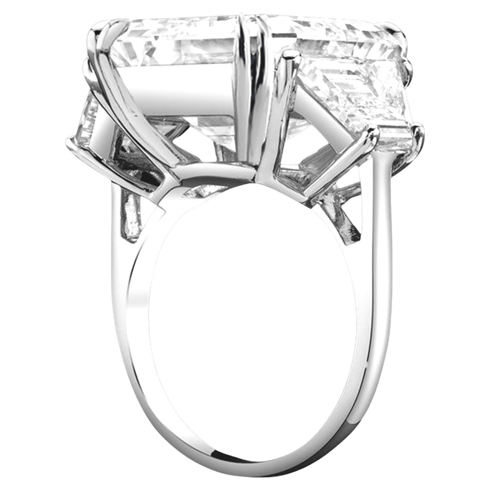 Exquisite Platinum Emerald Cut Diamond Engagement Ring - 5 ct Total Weight

This stunning three-stone engagement ring features a total of 5 carats of dazzling diamonds set in luxurious platinum. The centerpiece is a breathtaking 5 ct Natural Emerald