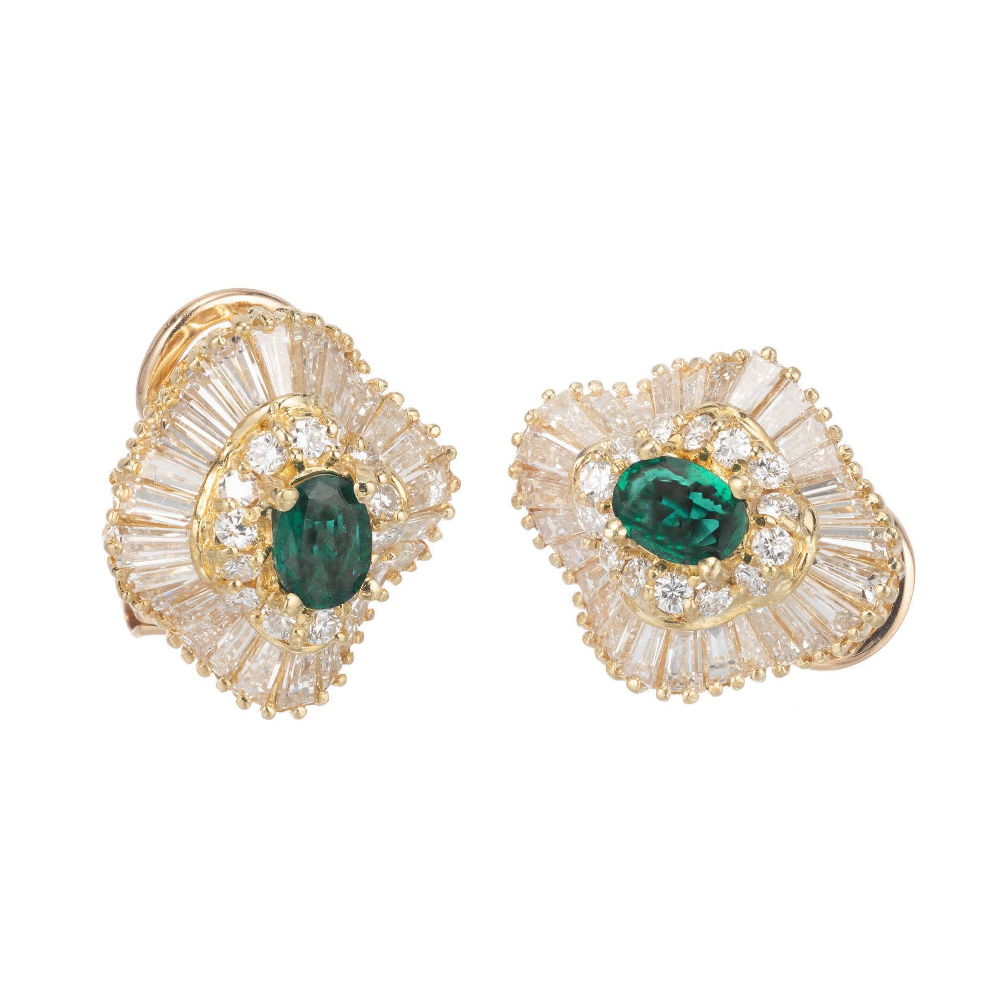 Natural untreated no enhancement emerald and diamond lever back fan style earrings.  GIA certified.  The emeralds are set in a ballerina style round and baguette diamond 18k yellow gold settings. 

2 oval deep green emerald, Approximate .60 carats.