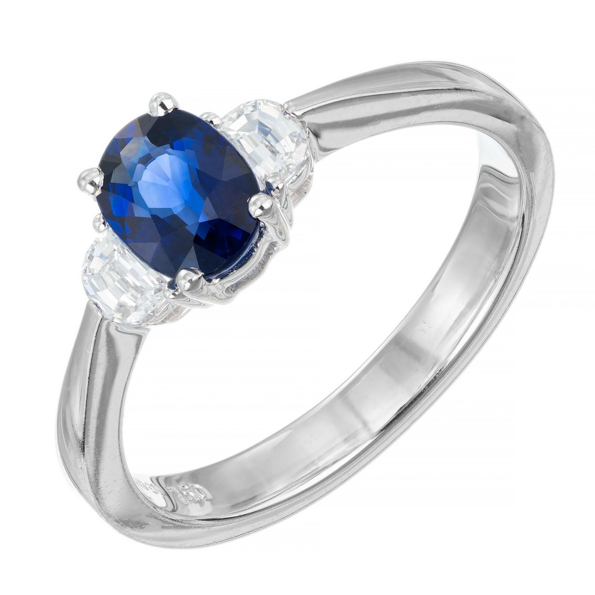 Sapphire and diamond engagement ring. GIA certified oval center stone with two half-moon side diamonds in a three-stone 18k white gold setting. 

1 GIA certificate #2145602011 oval Sapphire natural, approx. total weight .60cts, simple heat only, no