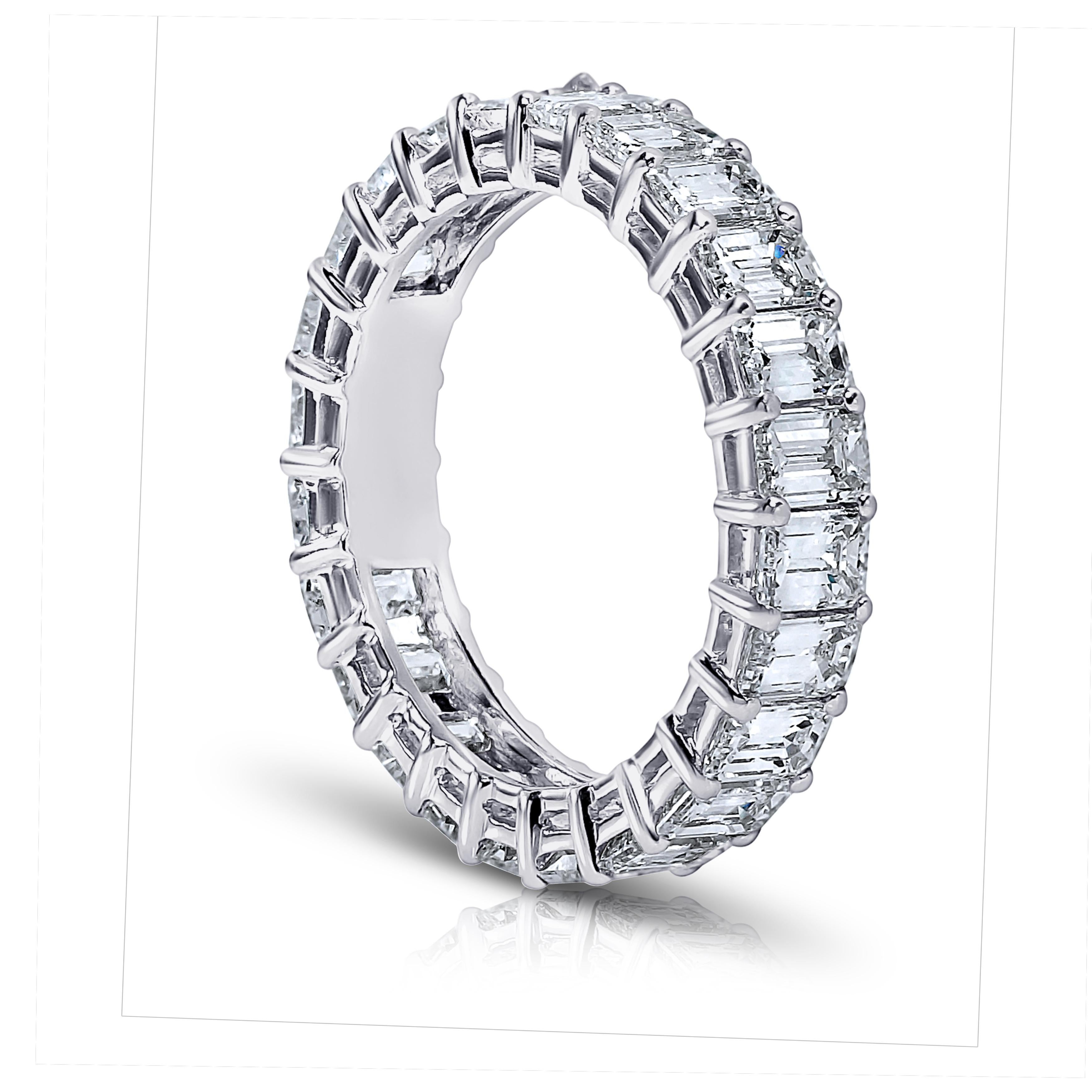 Emerald Cut diamond ring platinum eternity band shared prong style with a gallery. Finger size 6 .
 British finger size L1/2 . European finger size 51.5 . 
Other finger sizes available.

20 perfectly matched diamonds weighing a minimum of 6.00 cts.