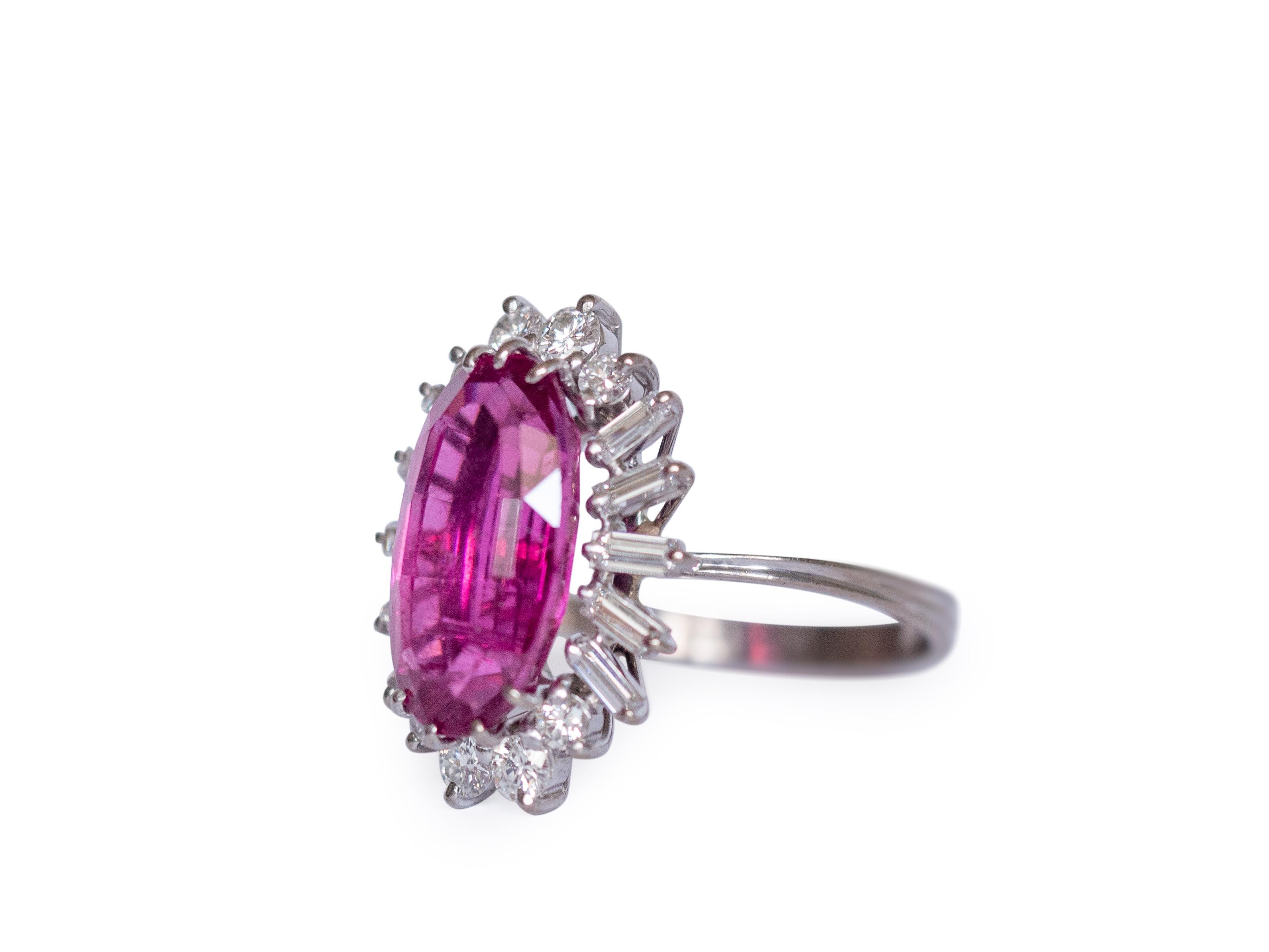 Ring Size: 8
Metal Type: 18K White Gold [Hallmarked, and Tested]
Weight:  6.5 grams

Center Stone Details:
GIA REPORT#2215041210
Type: Tourmaline, Natural
Weight: Approximately 6.00 carat
Cut: Oval Mixed Brilliant
Color: Purple/Pink


Side Diamond
