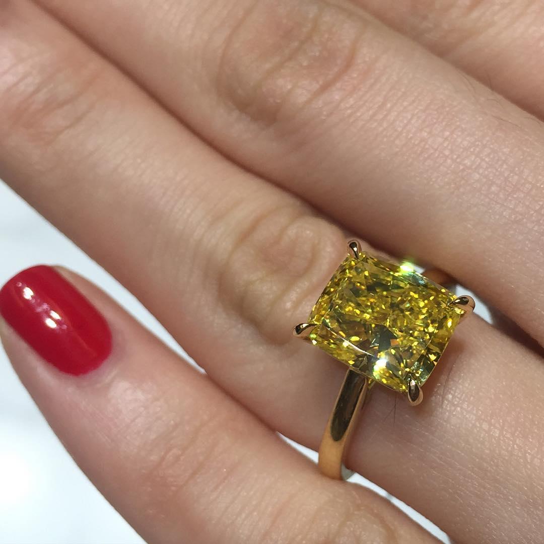 Contemporary GIA Certified 6.01 Carat Fancy Intense Yellow Cushion Diamond Yellow Gold Ring For Sale