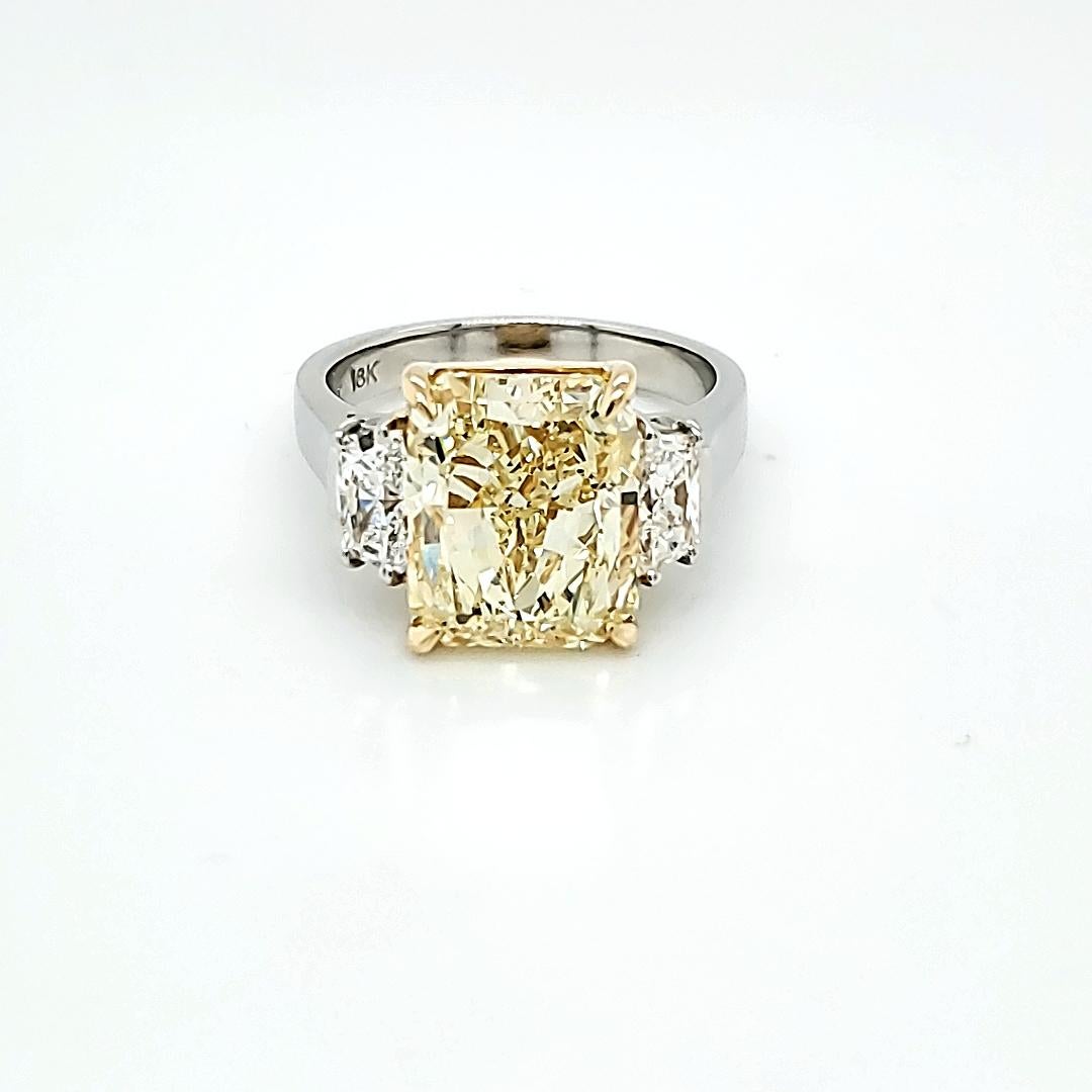 GIA Certified 6.02 Carat Fancy Yellow Radiant Cut Diamond Three-Stone Ring In New Condition In New York, NY