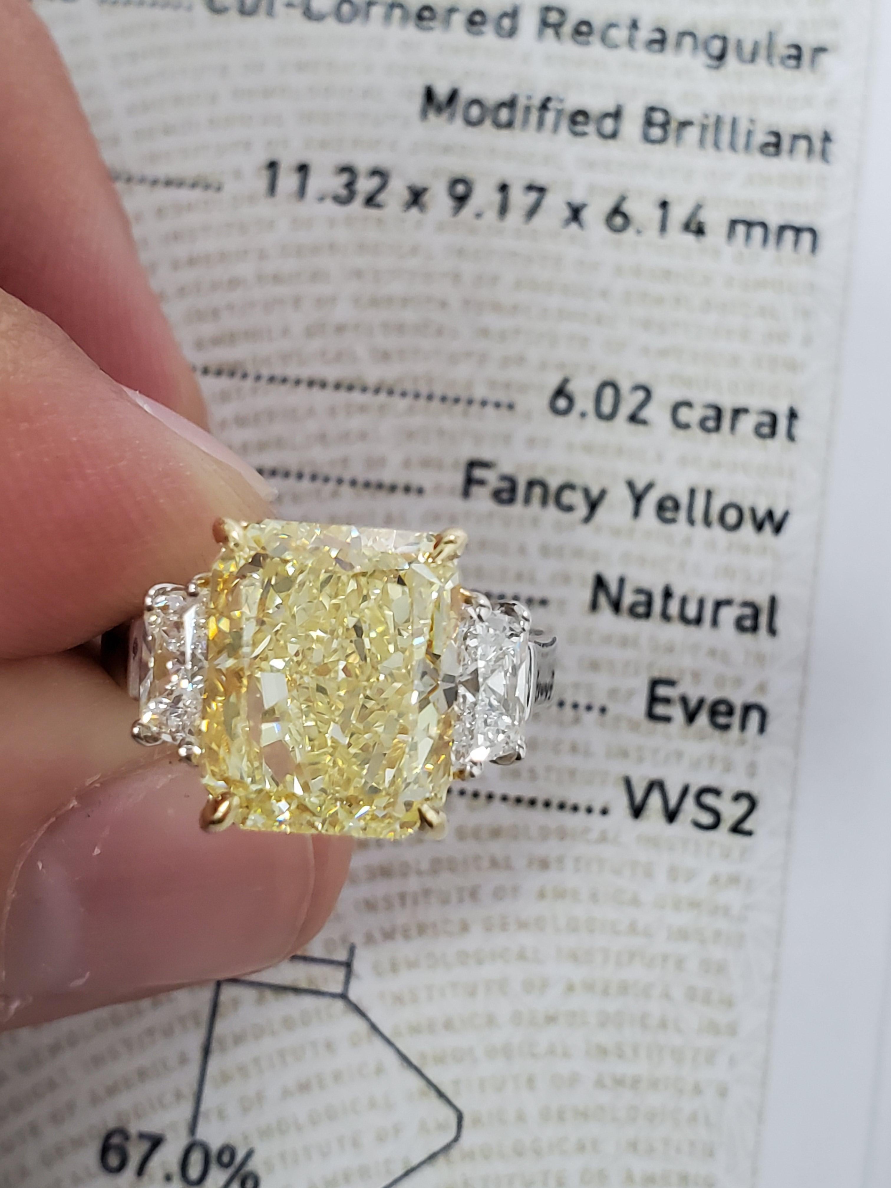 Women's GIA Certified 6.02 Carat Fancy Yellow Radiant Cut Diamond Three-Stone Ring