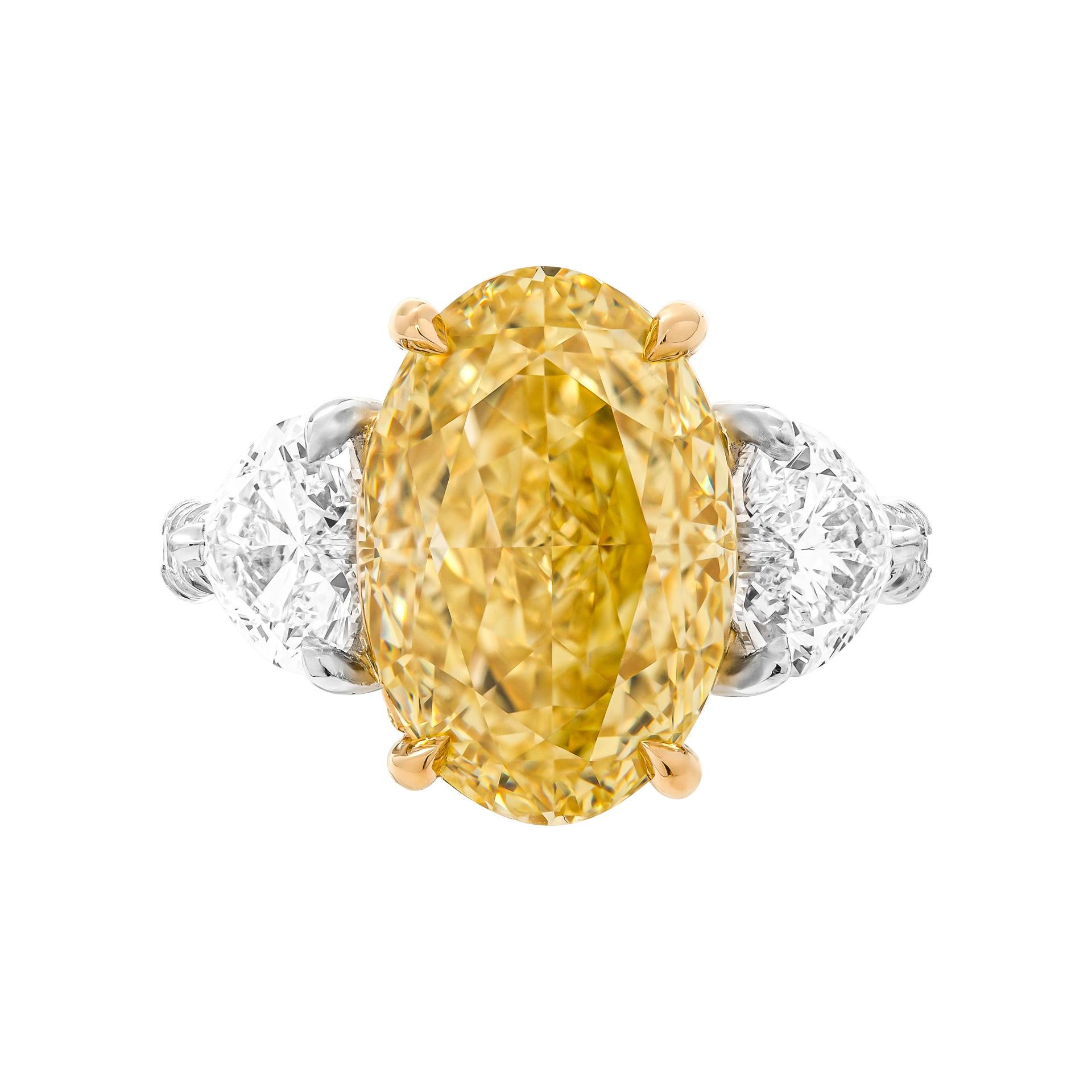 Modern GIA Certified 6.02ct Natural Fancy Yellow Even VVS2 Oval Cut Three-Stone Ring For Sale