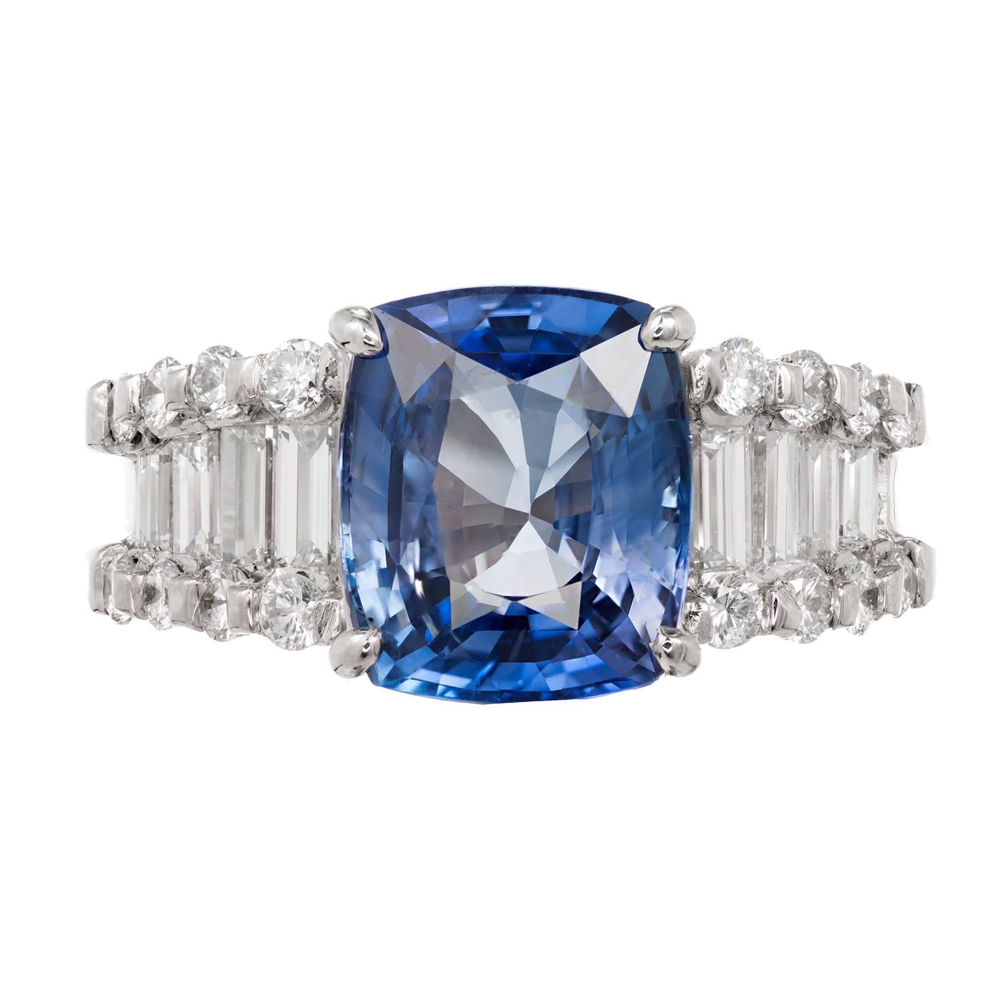 1950-1960 Estate bright blue 6.03 carat cushion cut GIA certified natural sapphire and diamond engagement ring. Platinum setting with a Simple heat, no other enhancement sapphire with emerald and round cut diamond accents. 

1 cushion cut blue