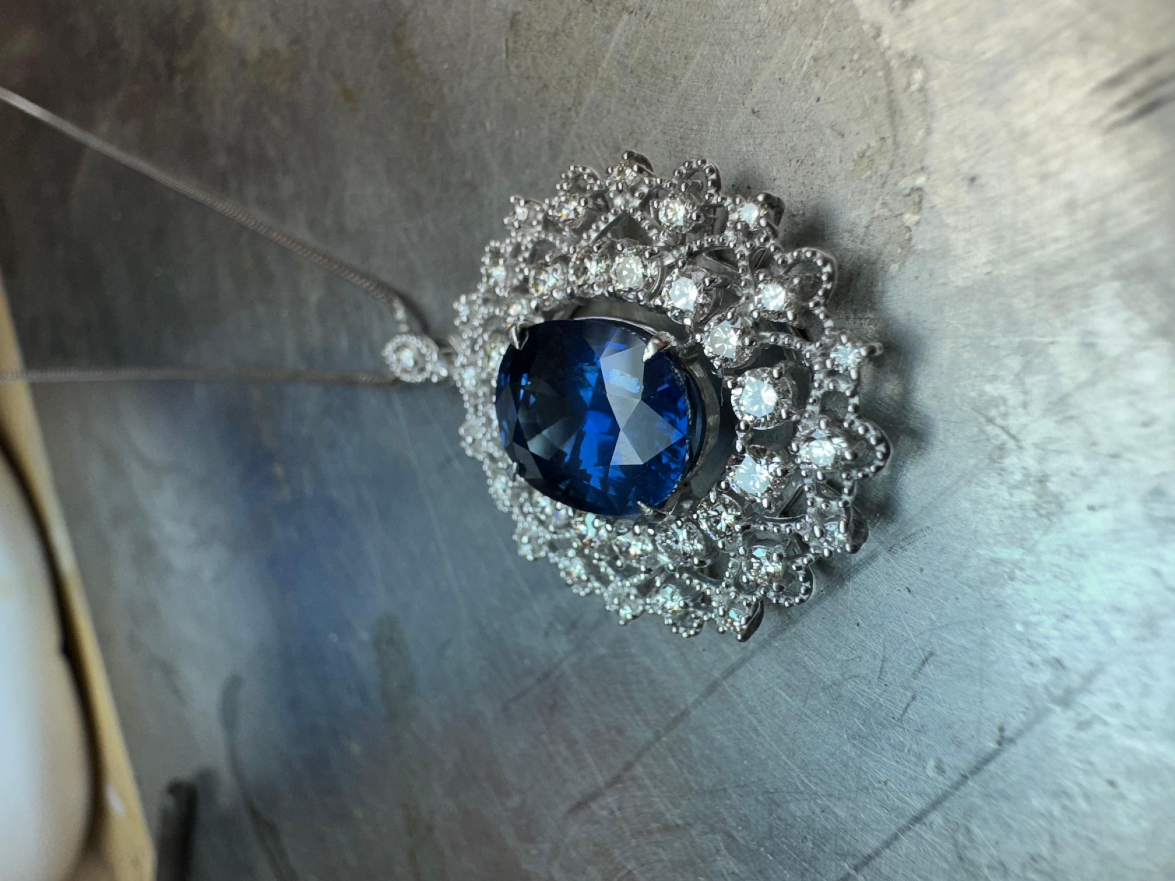 DeKara Designs Collection

A Beautiful Timeless Handmade Platinum Halo Diamond Necklace.

Metal- 95% Platinum, 5% Iridium.

Stones- GIA Certified Oval Blue Sapphire 6.03 Carats, 38 Round Diamonds G-H Color VS2-SI1 Clarity 1.25 Carats.

GIA Report