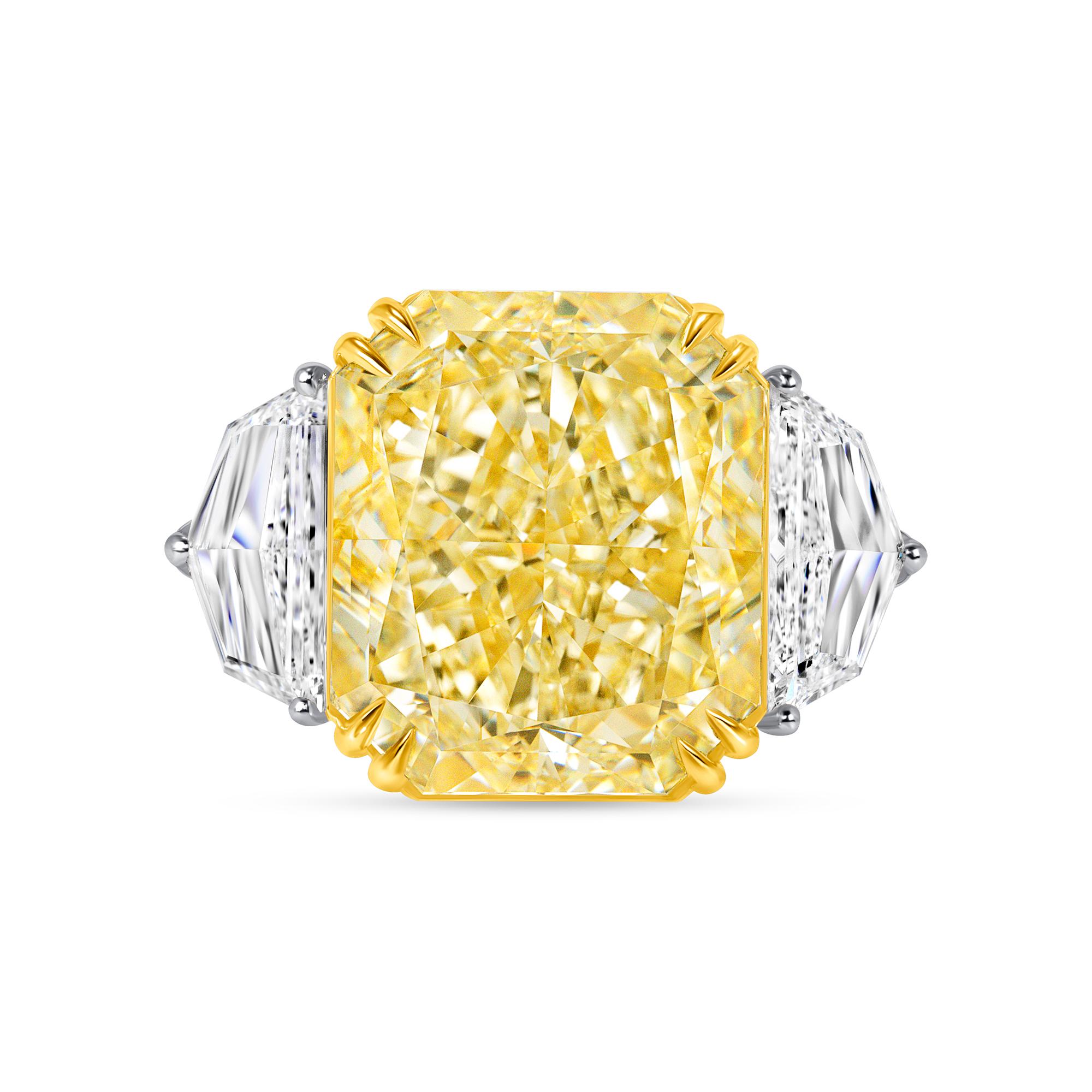 Radiant Cut W-X Yellow Diamond Three Stone Ring set in 18K Yellow Gold and Platinum. This three stone ring has a 6.04 Radiant cut diamond in GIA certified W-X color, SI1 clarity and two Half Moon shape diamonds in D to E color, VVS clarity with a