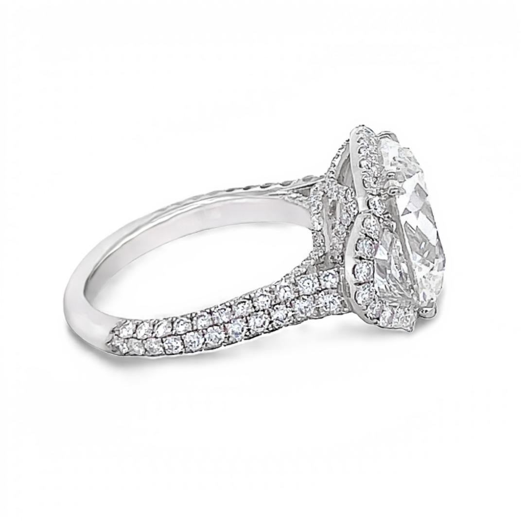 three stone elongated cushion engagement ring